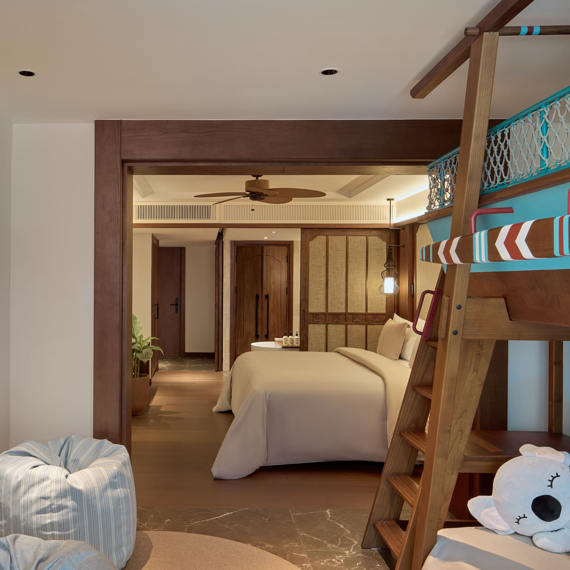 a room with a bed and a bunk bed