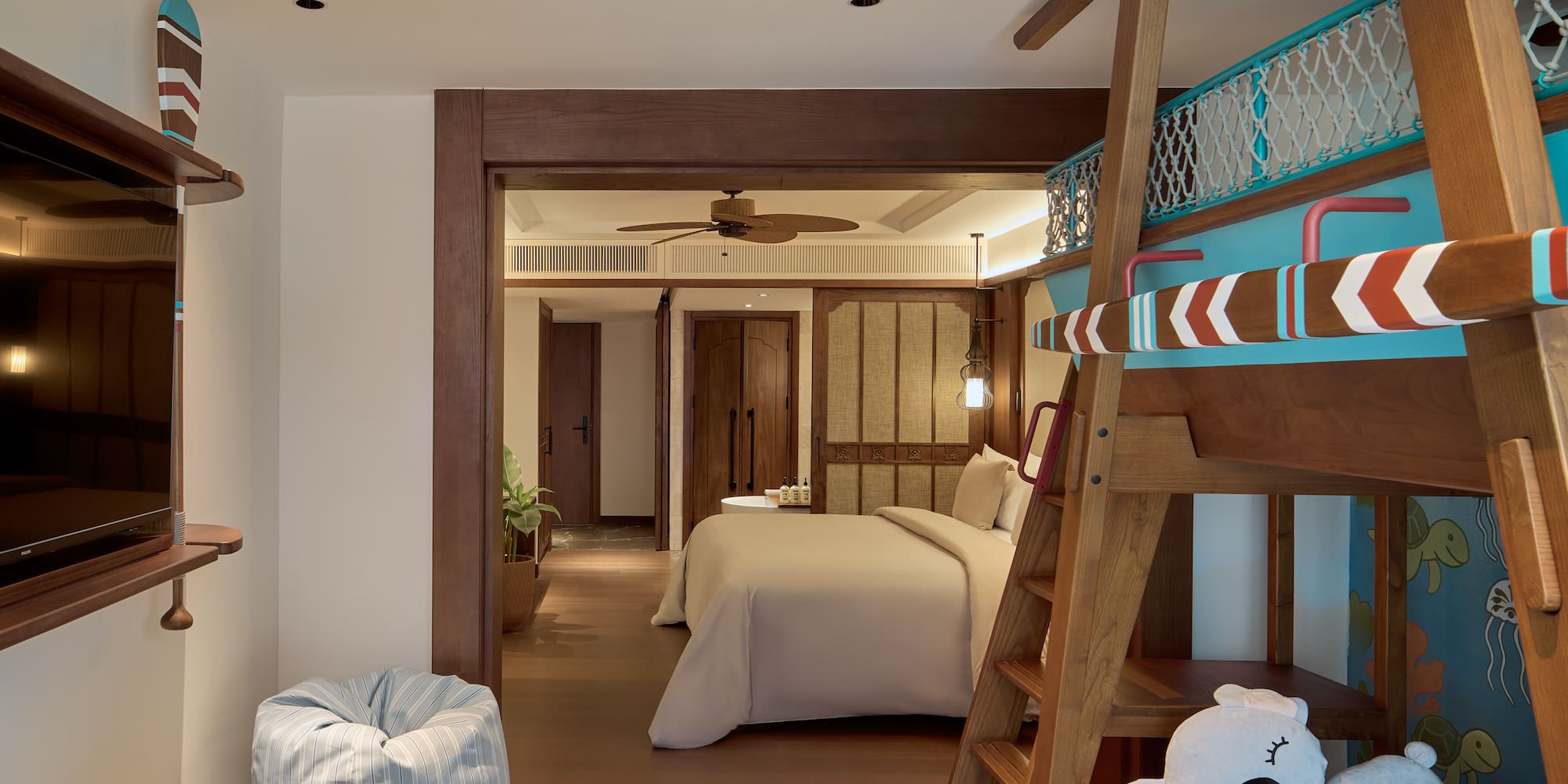 a room with a bed and a bunk bed