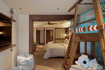 a room with a bed and a bunk bed