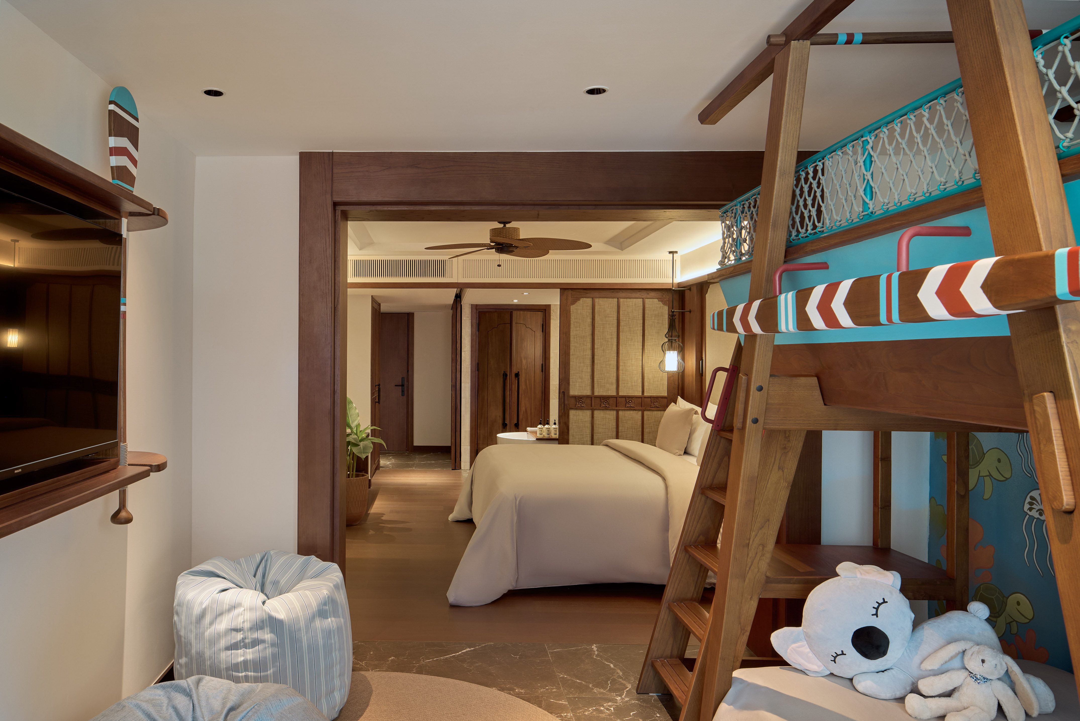 a room with a bed and a bunk bed