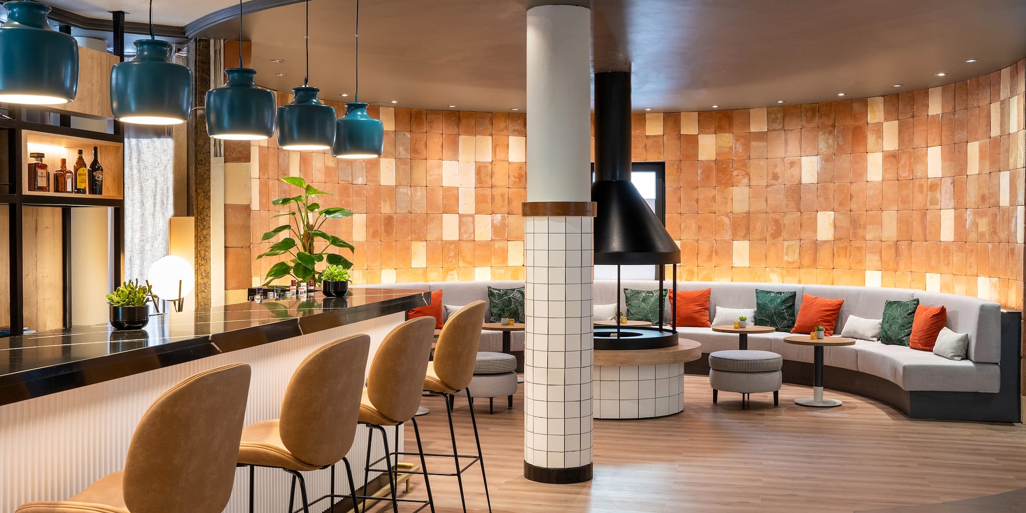 a room with a bar and chairs