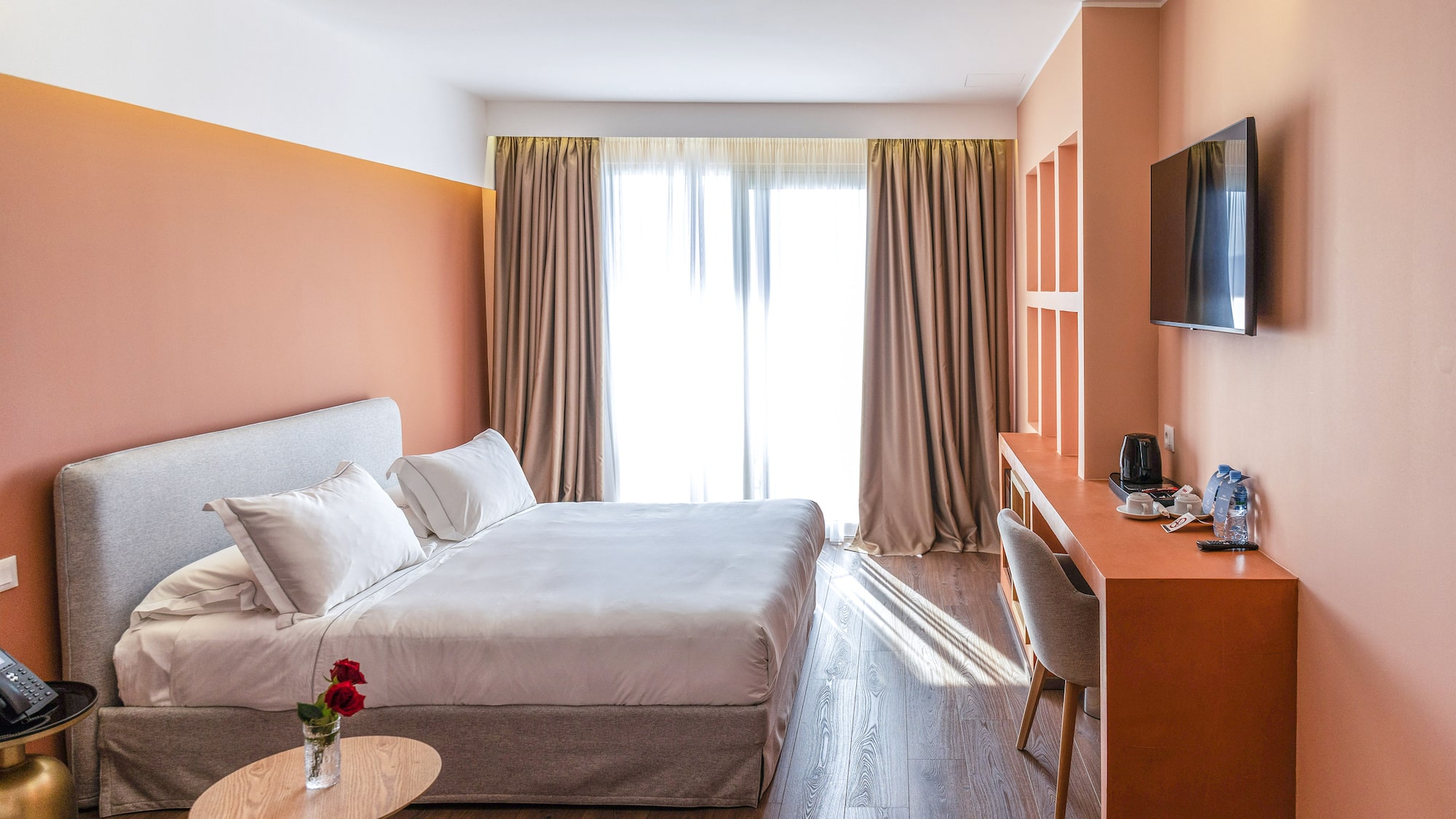 a room with a bed and a desk