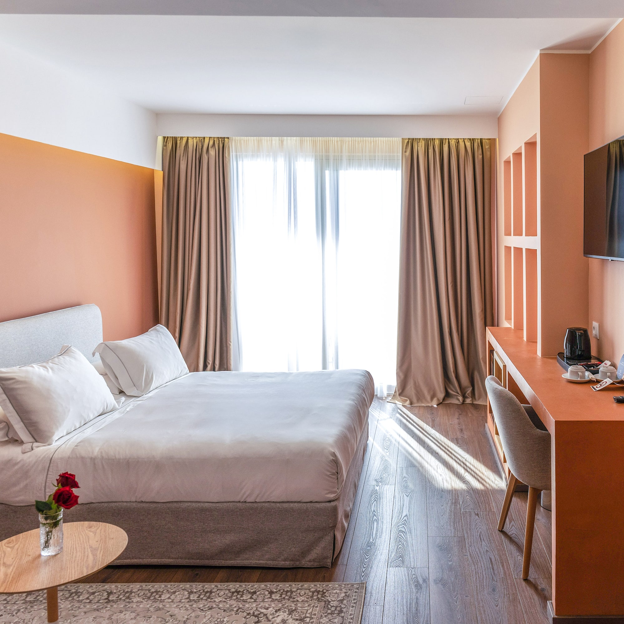 a room with a bed and a desk