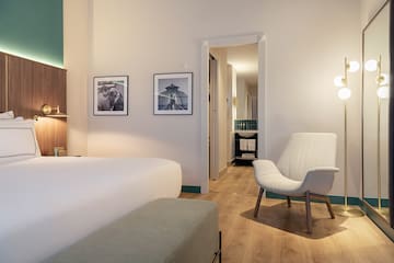 a room with a bed and a chair