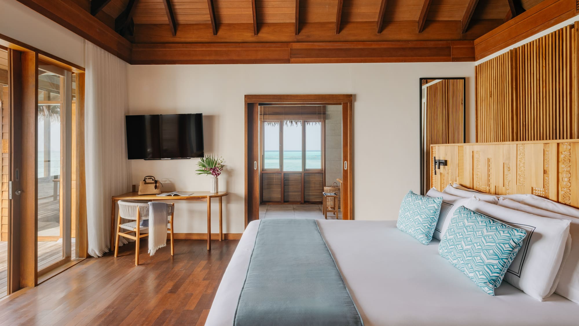 a bedroom with a bed and a bench