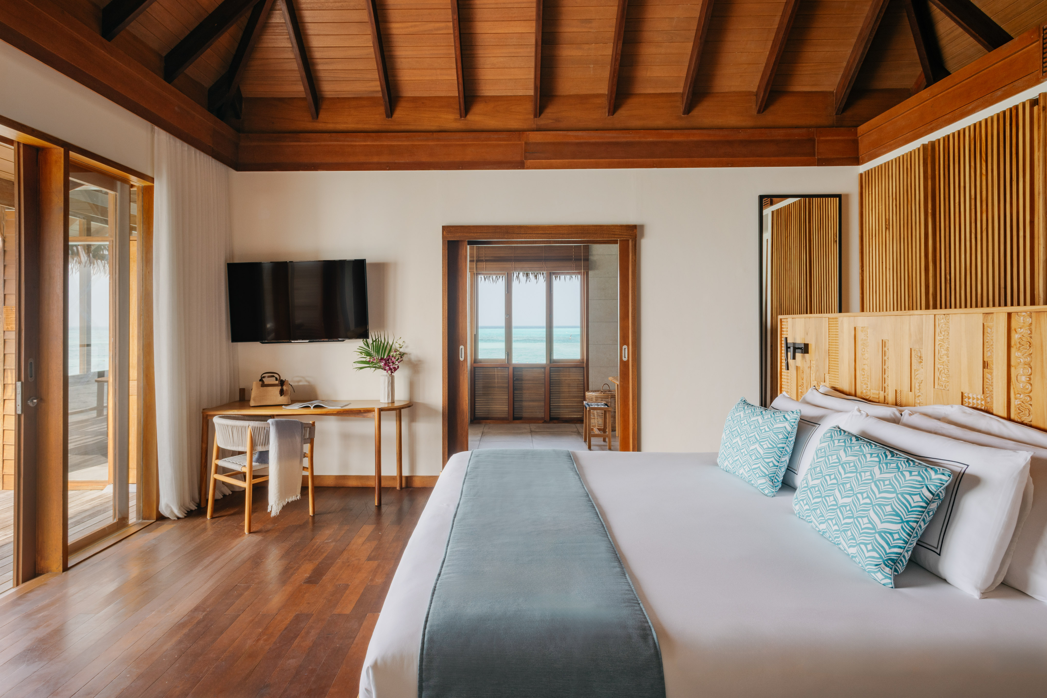 a bedroom with a bed and a bench