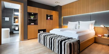 a room with a bed and a wood floor