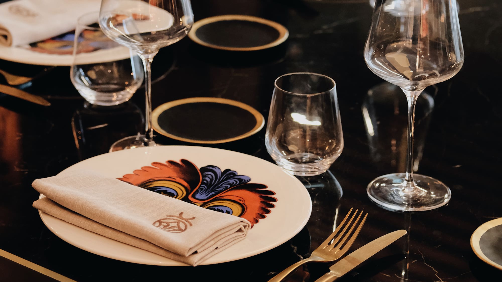 a table with plates and glasses