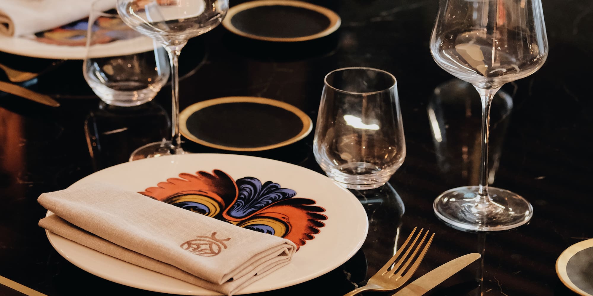 a table with plates and glasses