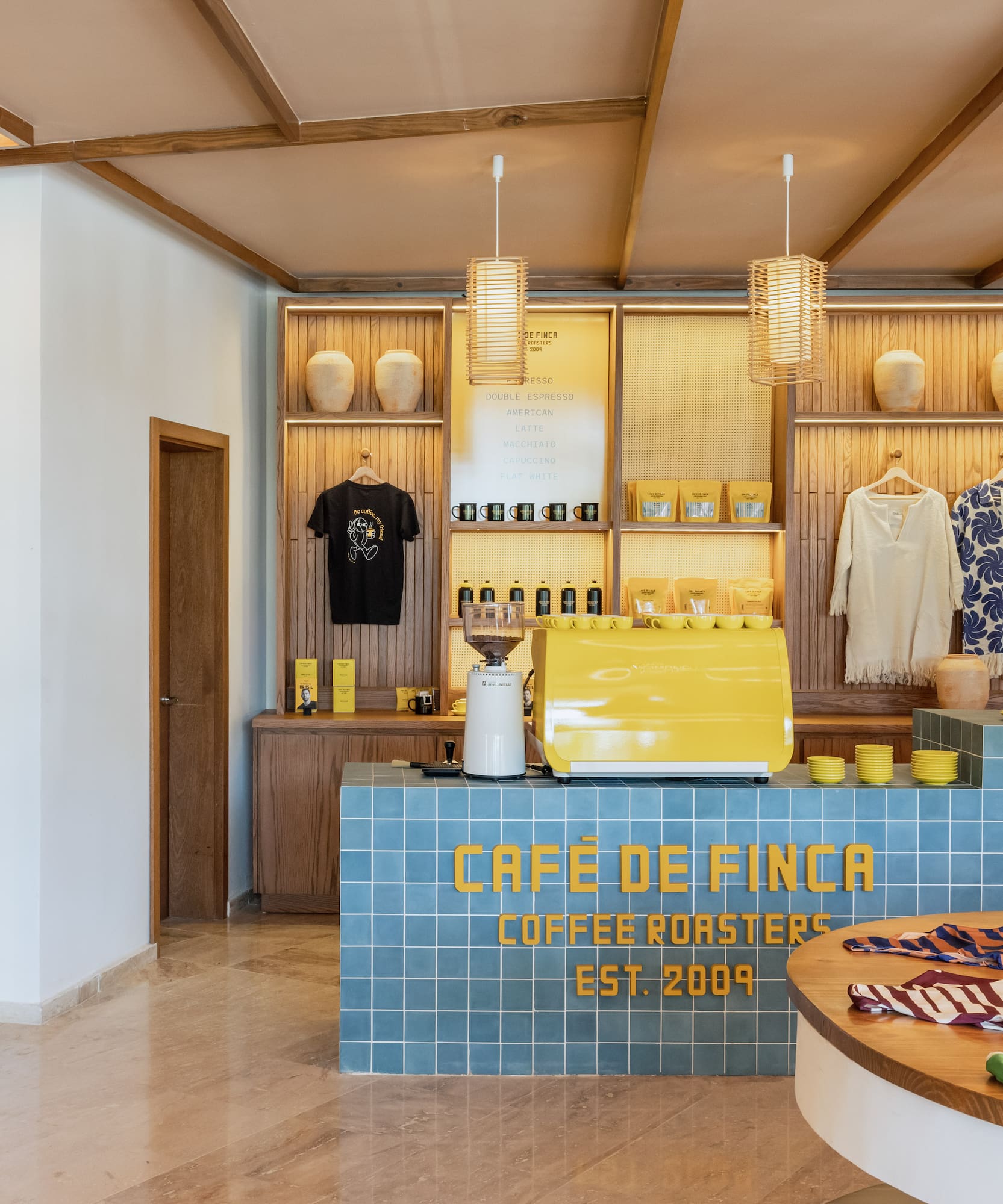 a coffee shop with a counter and a round table