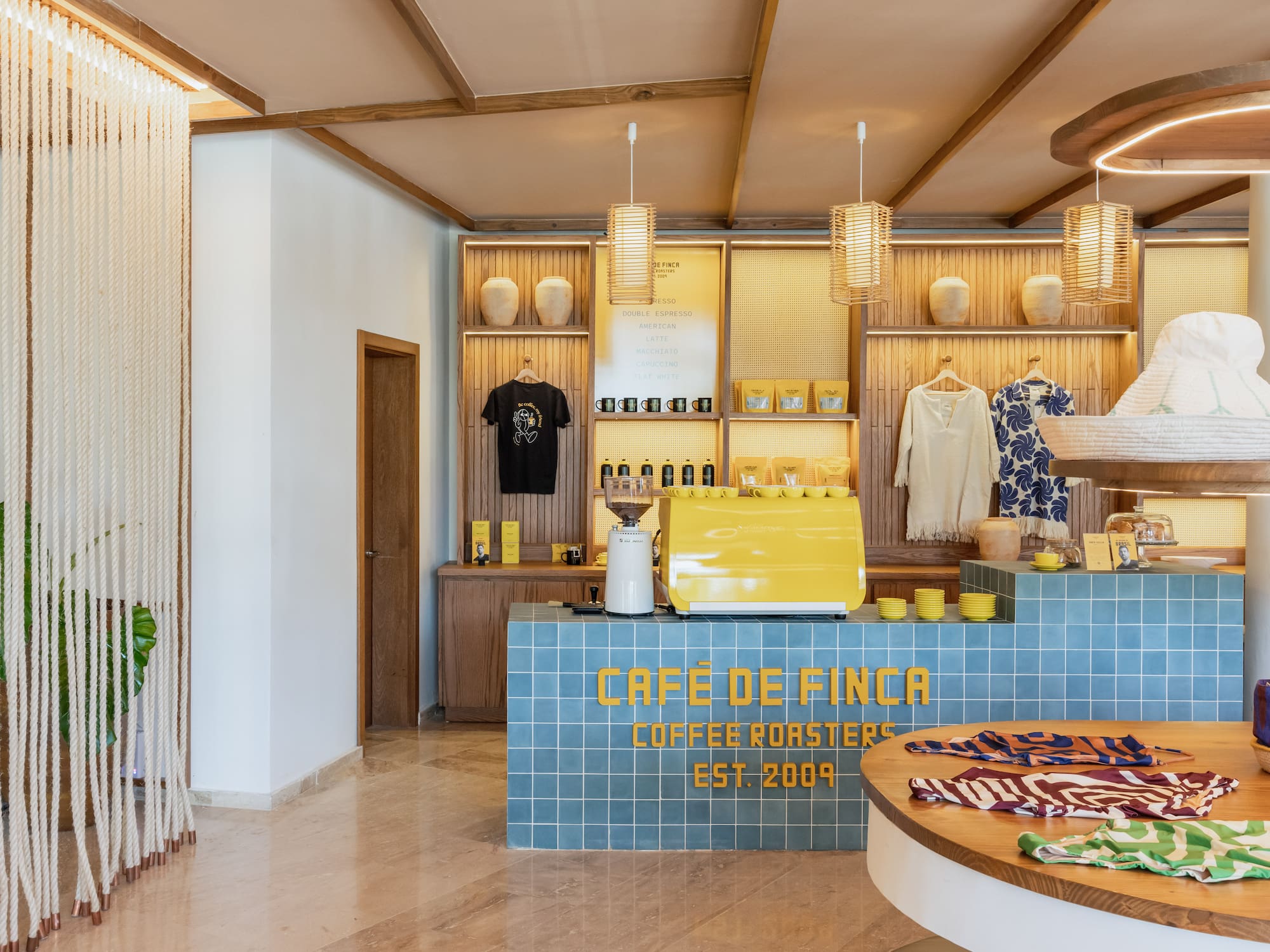 a coffee shop with a counter and a round table
