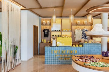 a coffee shop with a counter and a round table