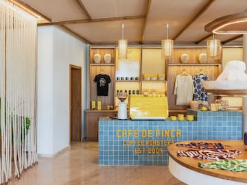 a coffee shop with a counter and a round table