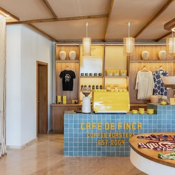 a coffee shop with a counter and a round table