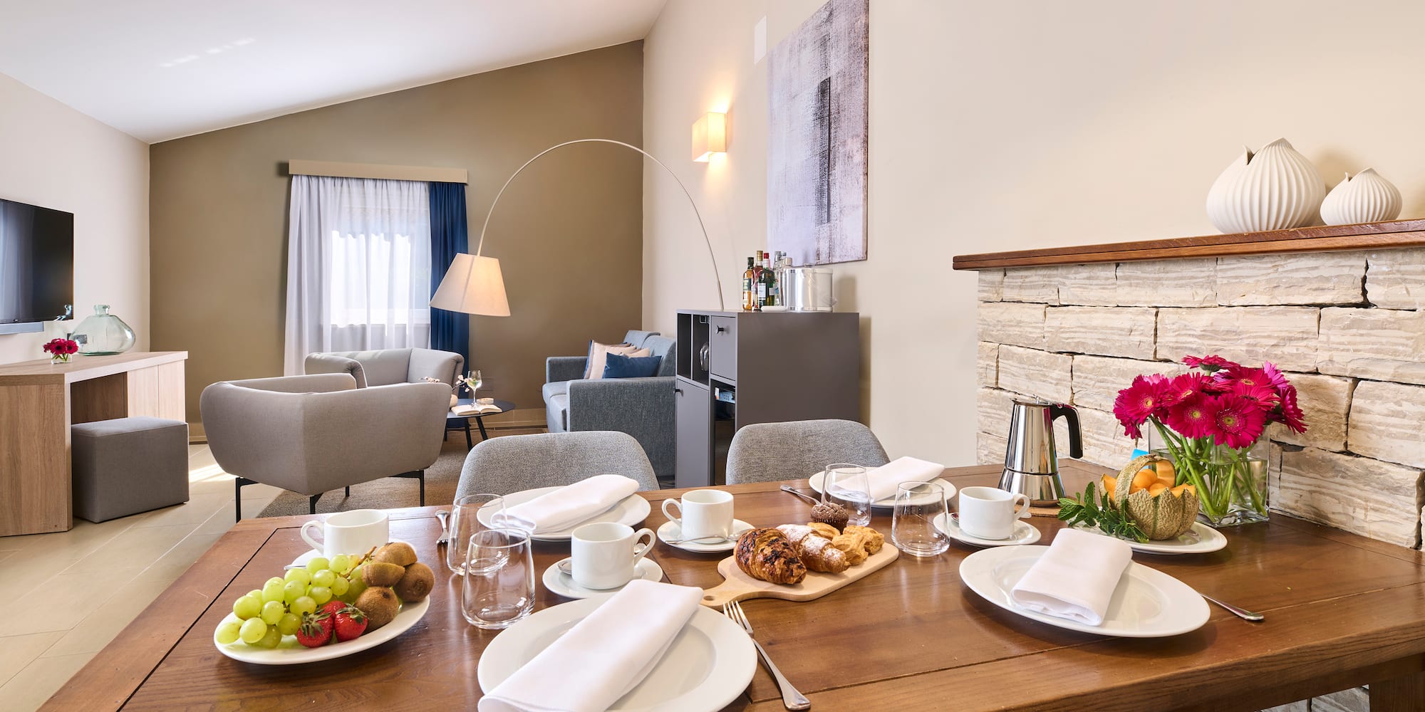 a table with plates of food and glasses on it