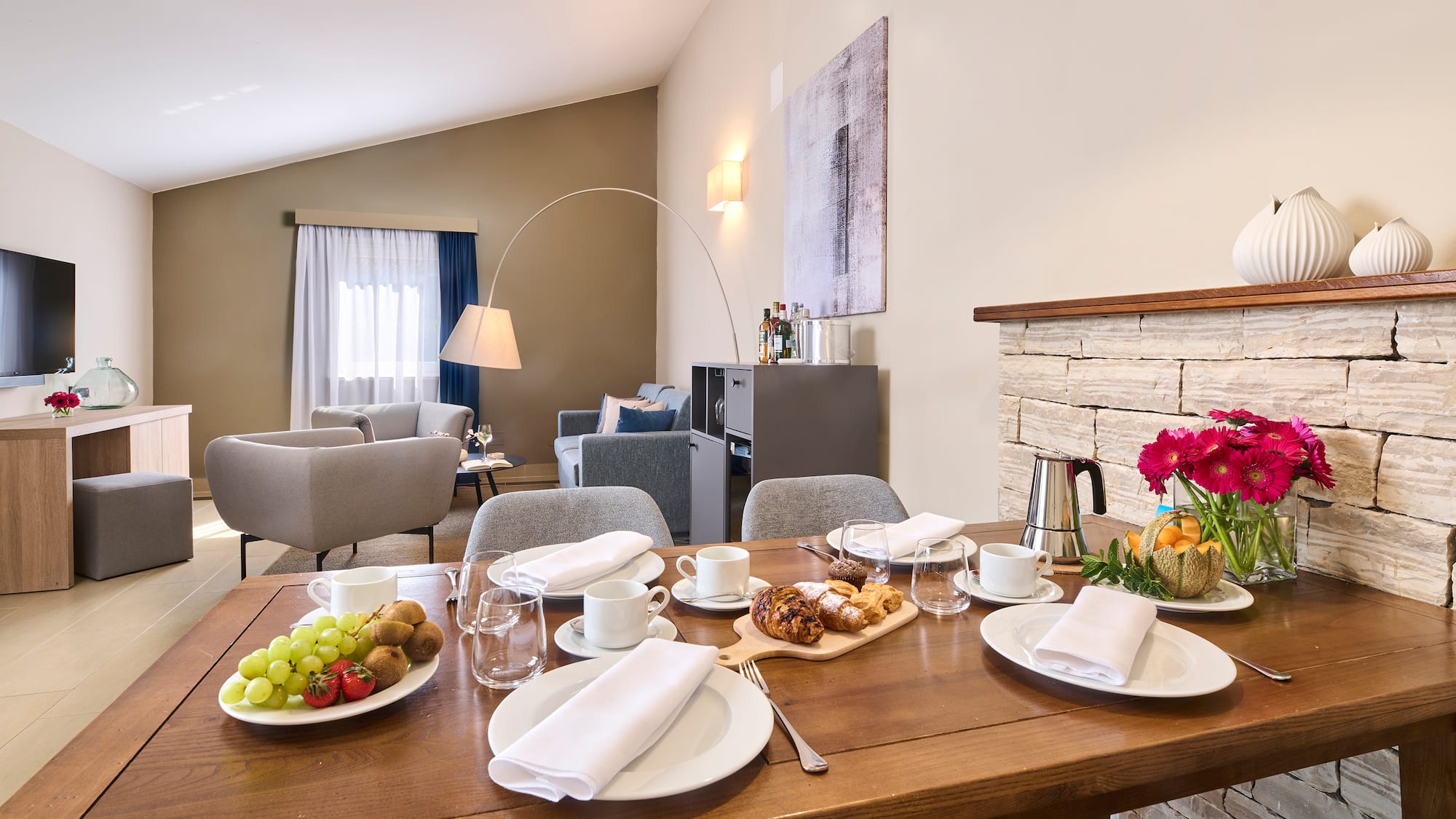 a table with plates of food and glasses on it