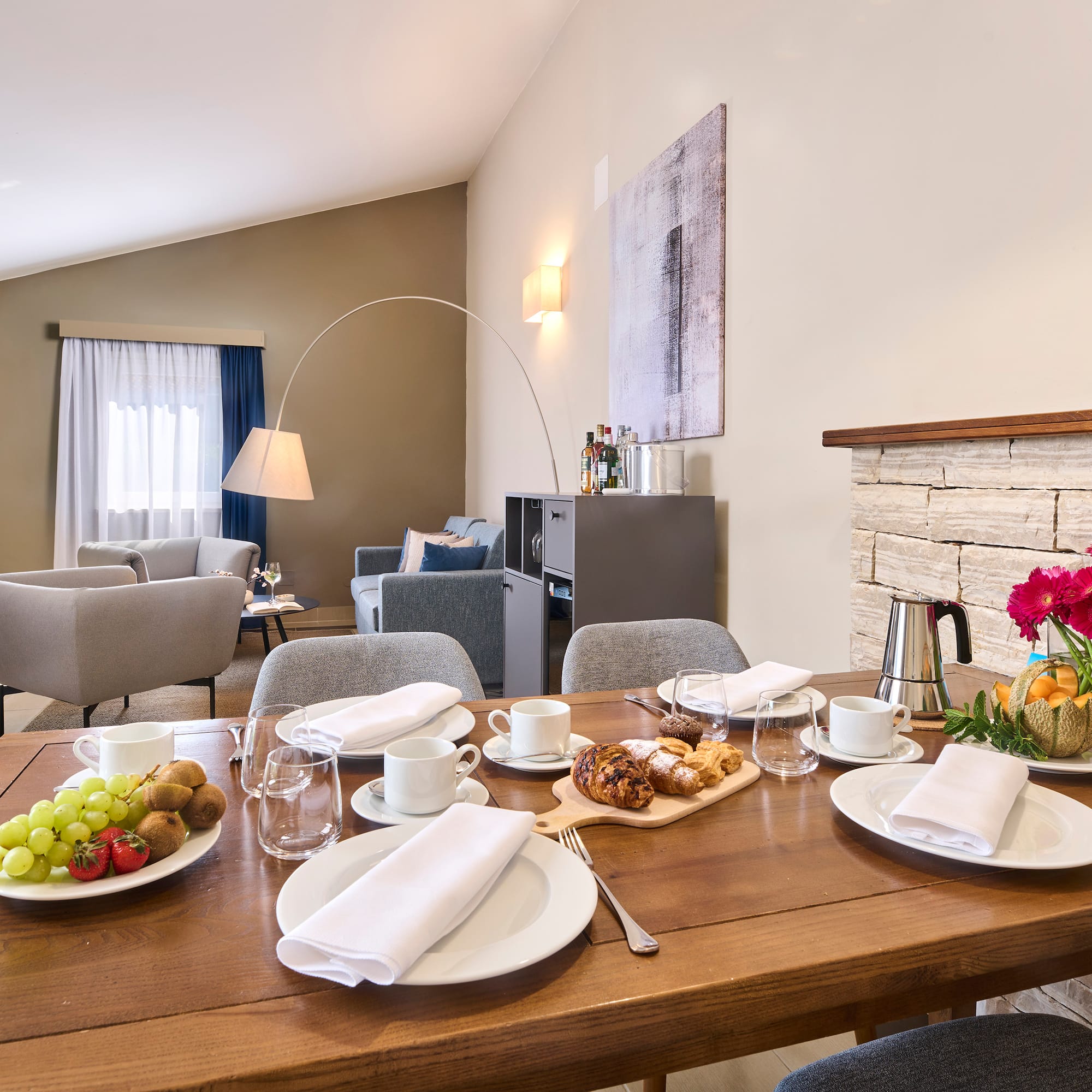 a table with plates of food and glasses on it