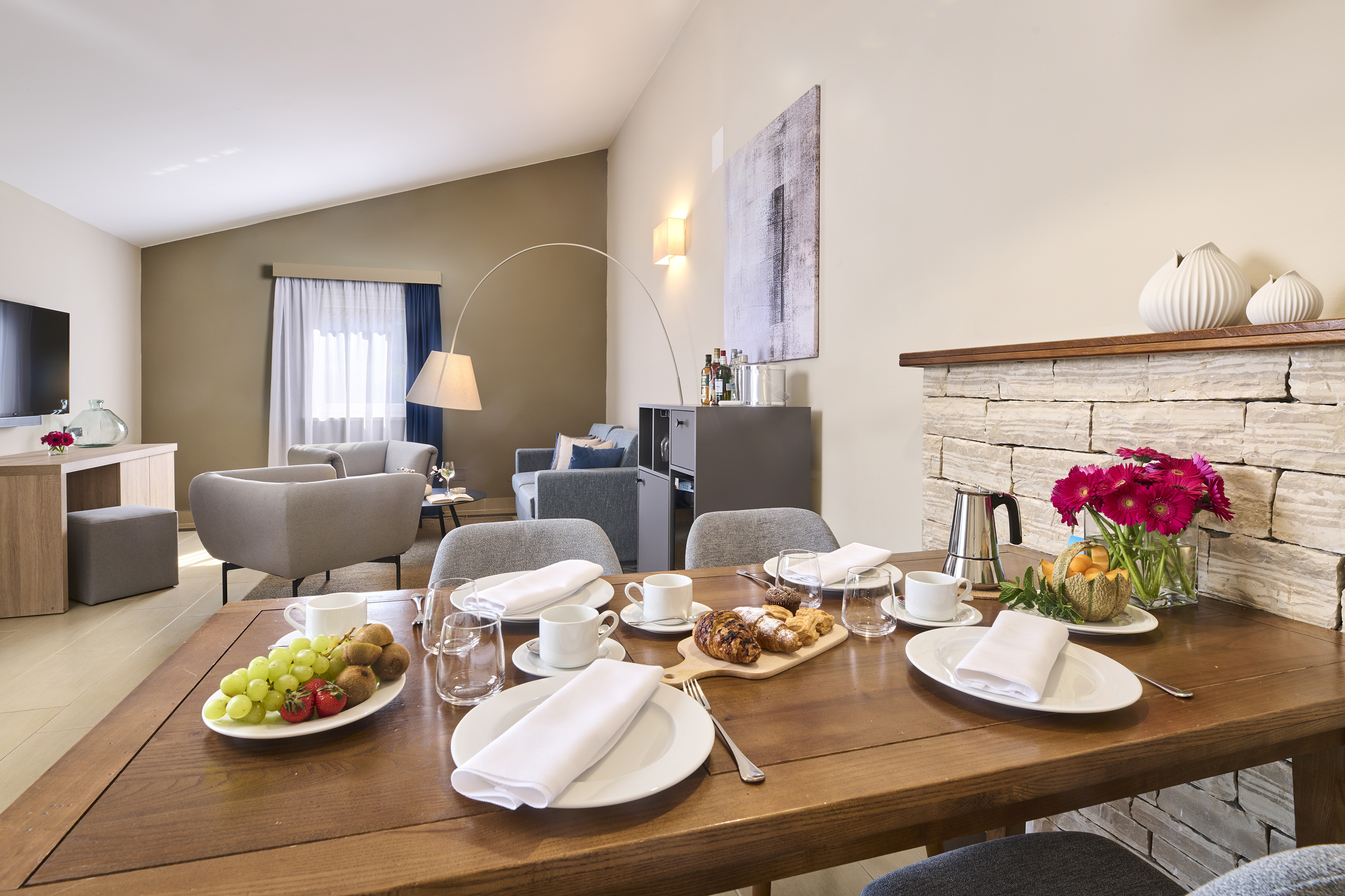 a table with plates of food and glasses on it