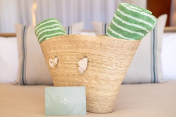 a basket with towels and a card