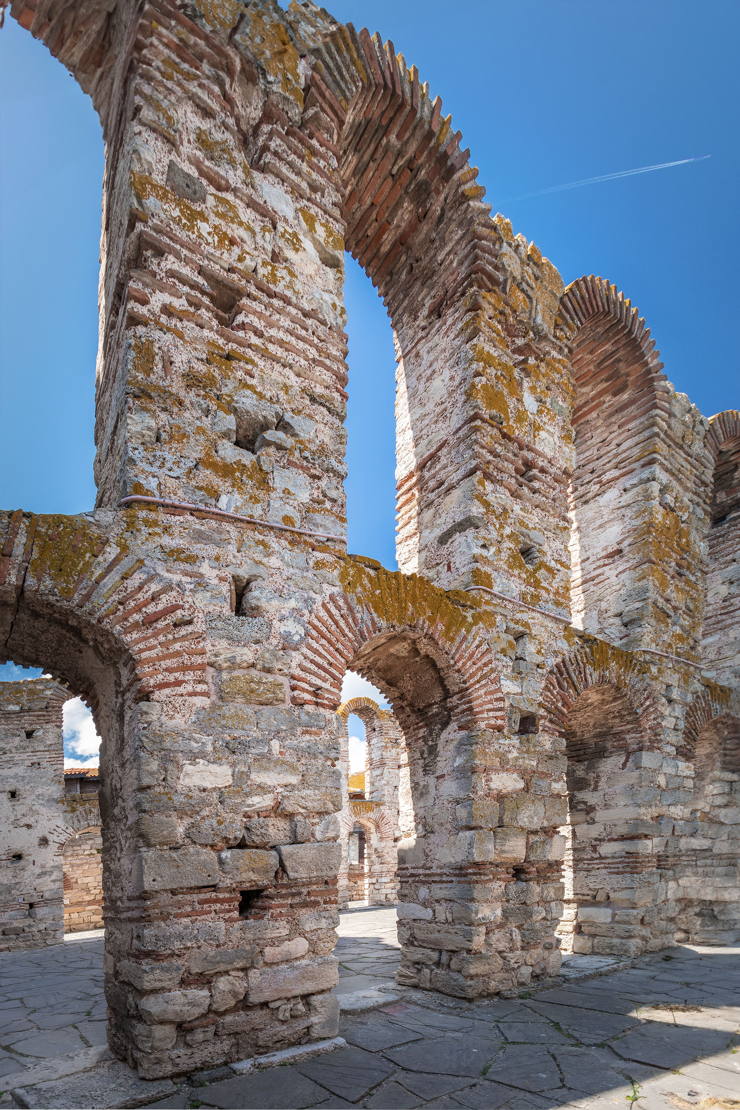 a stone wall with arches