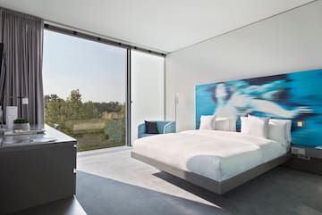 a bedroom with a large window