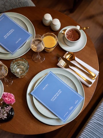 a table with plates and glasses and utensils