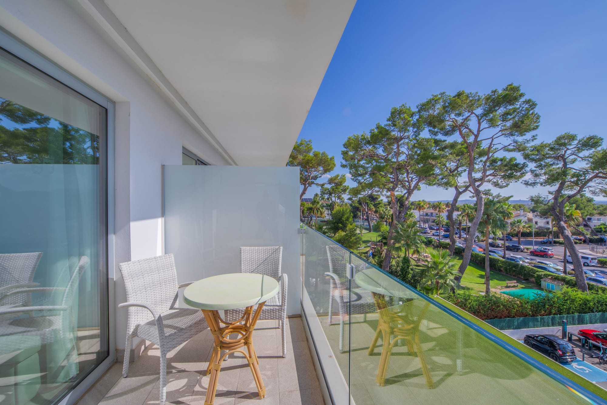a balcony with a table and chairs