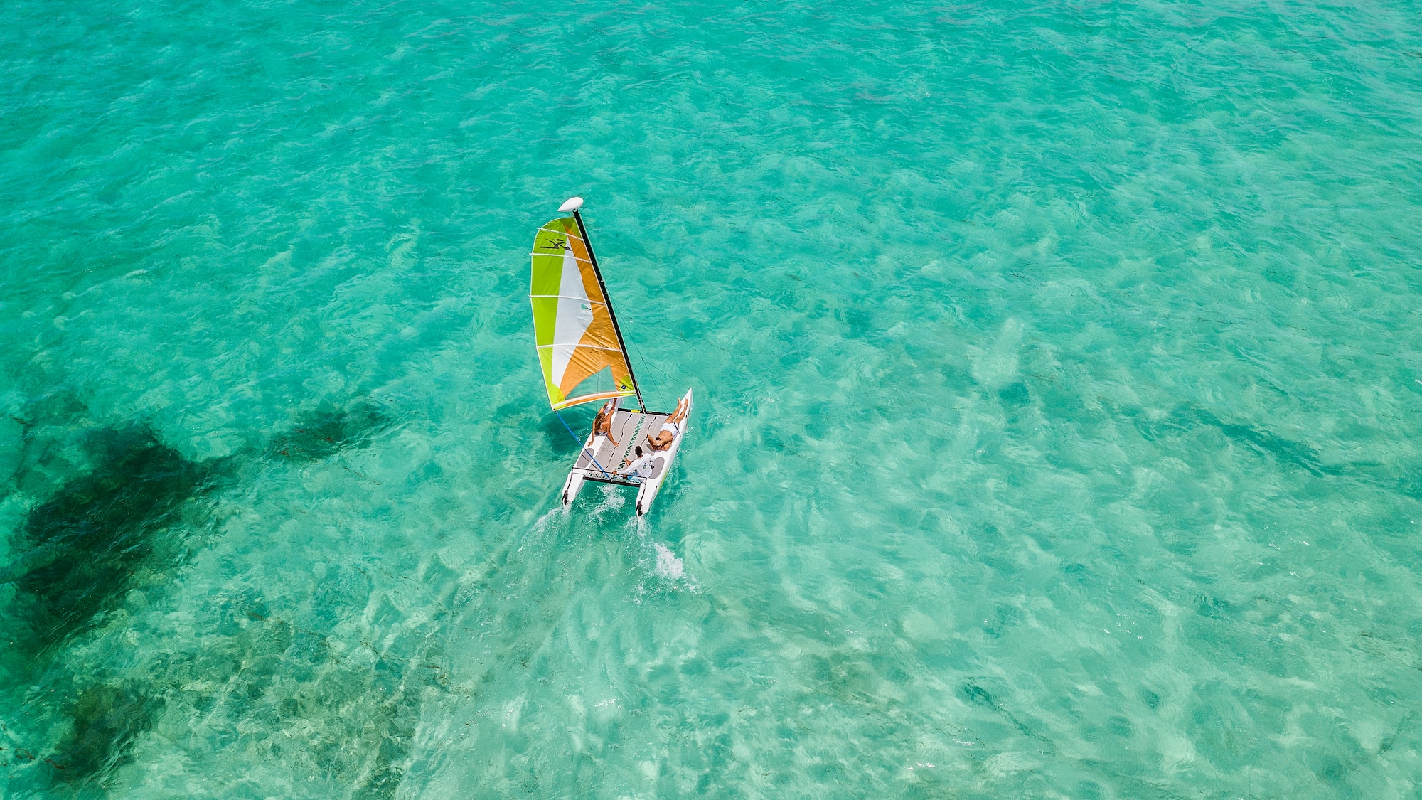 a person on a sailboat in the water