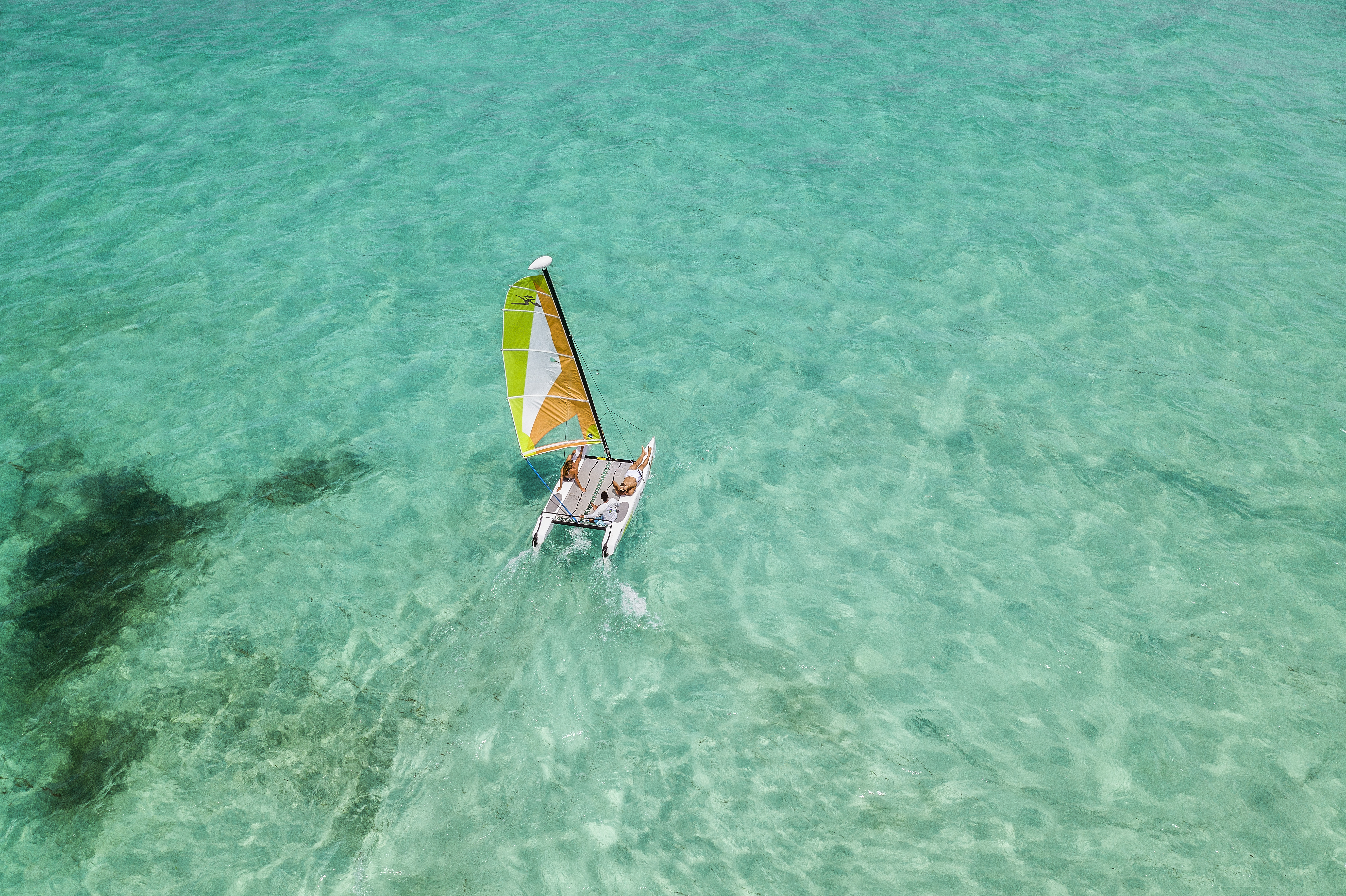 a person on a sailboat in the water