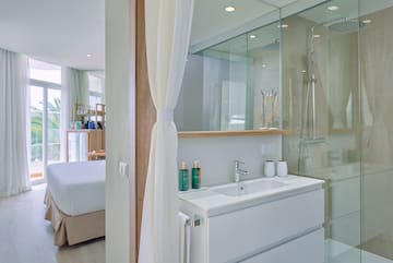 a bathroom with a shower and a sink