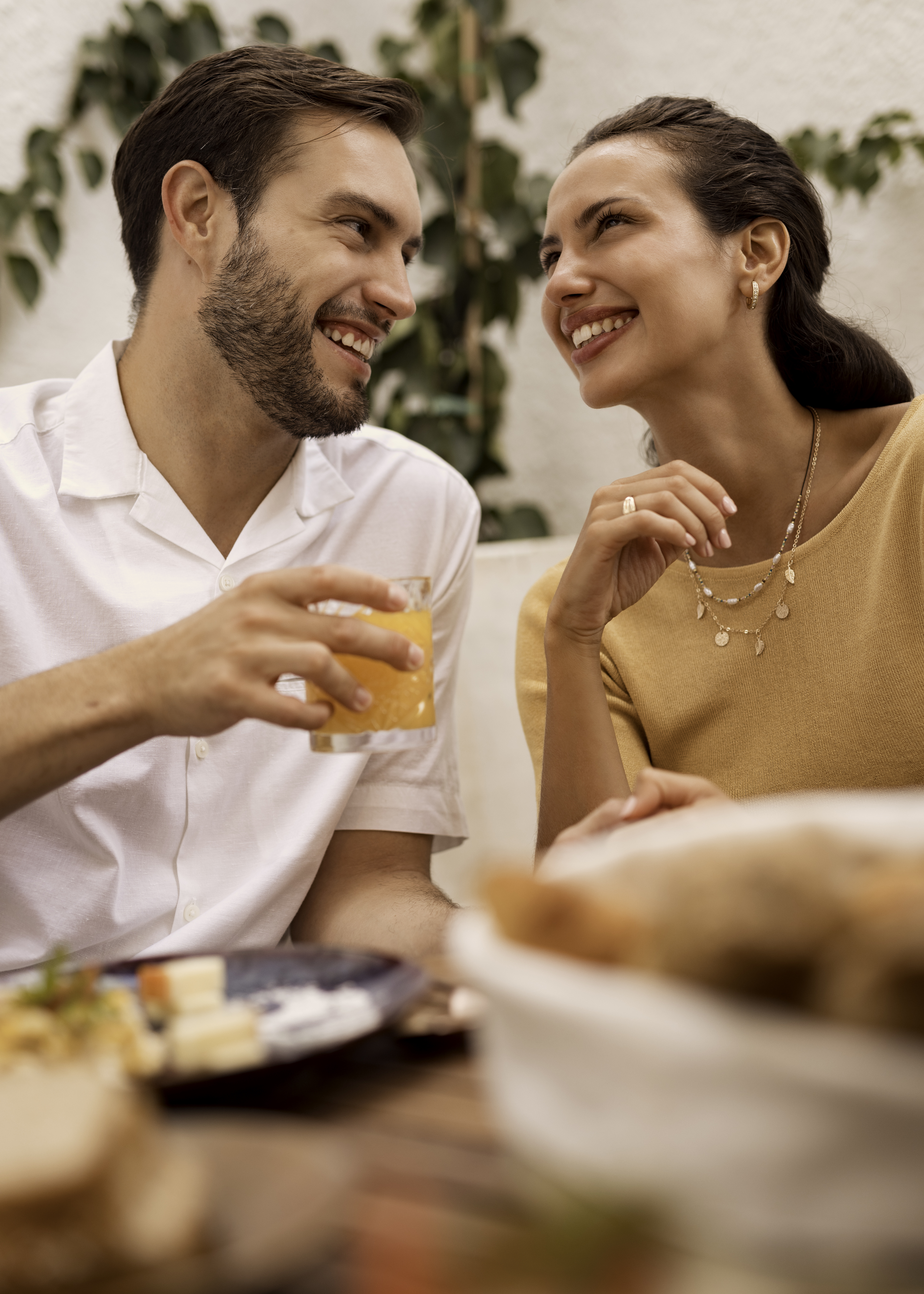 a man and woman sitting at a table