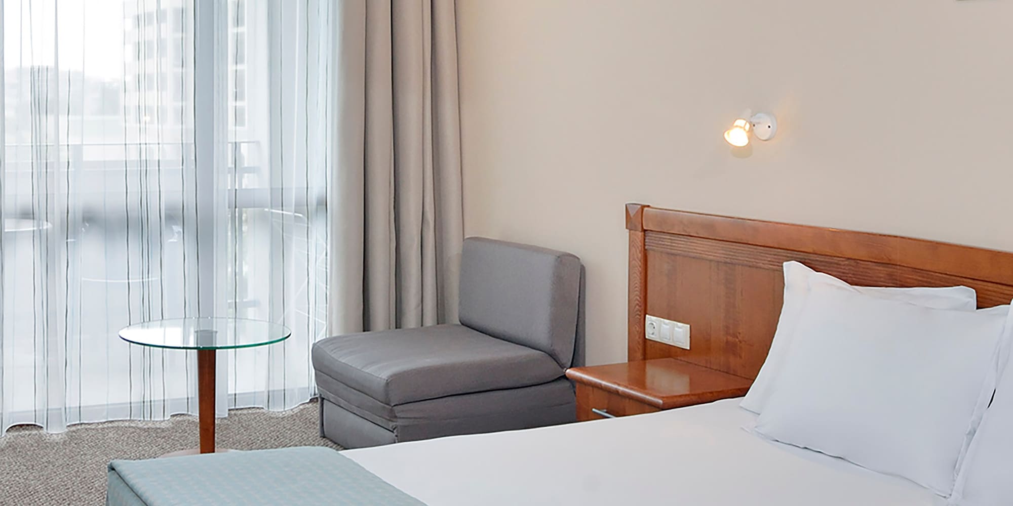 a room with a bed and a chair