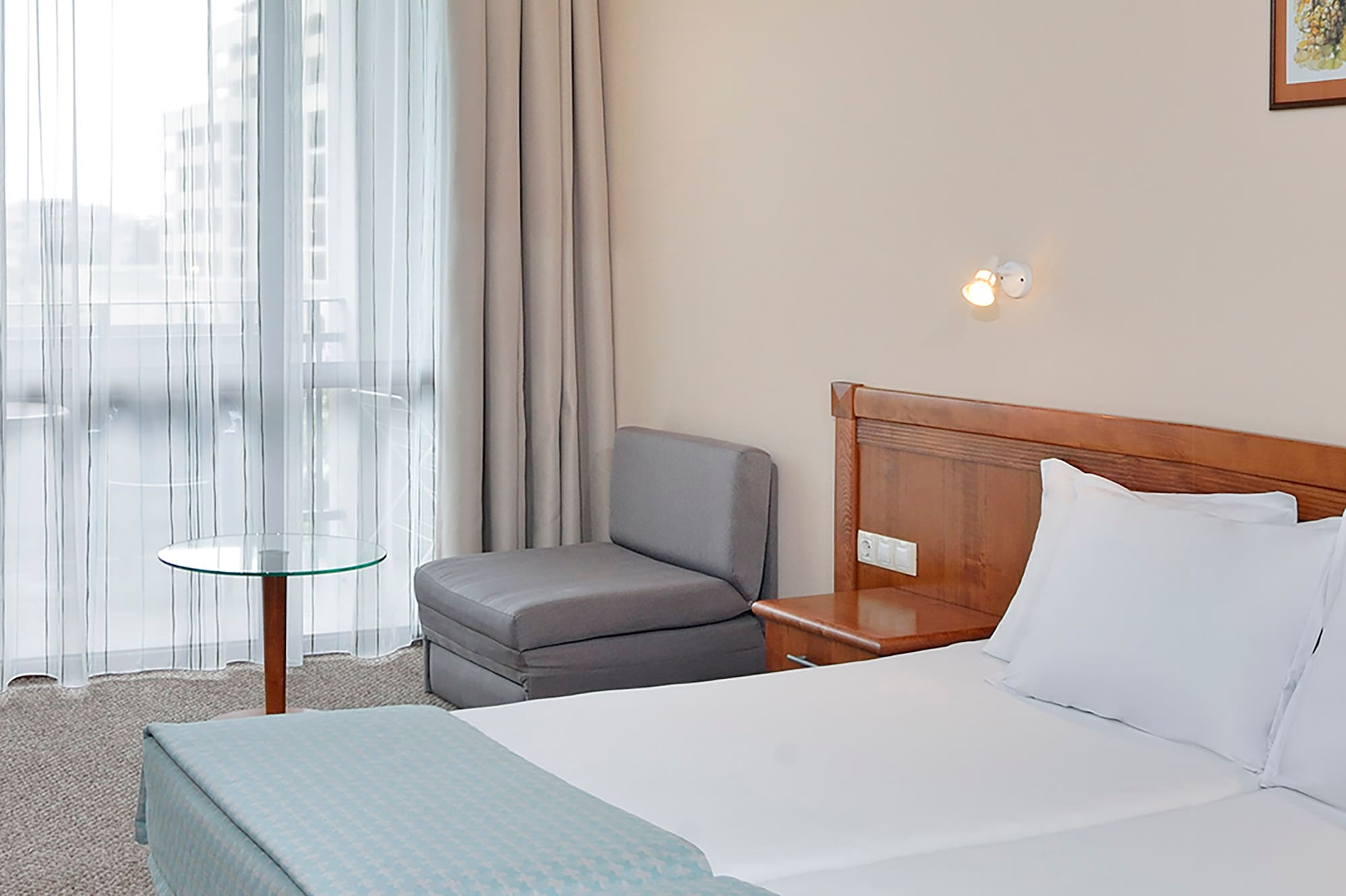 a room with a bed and a chair