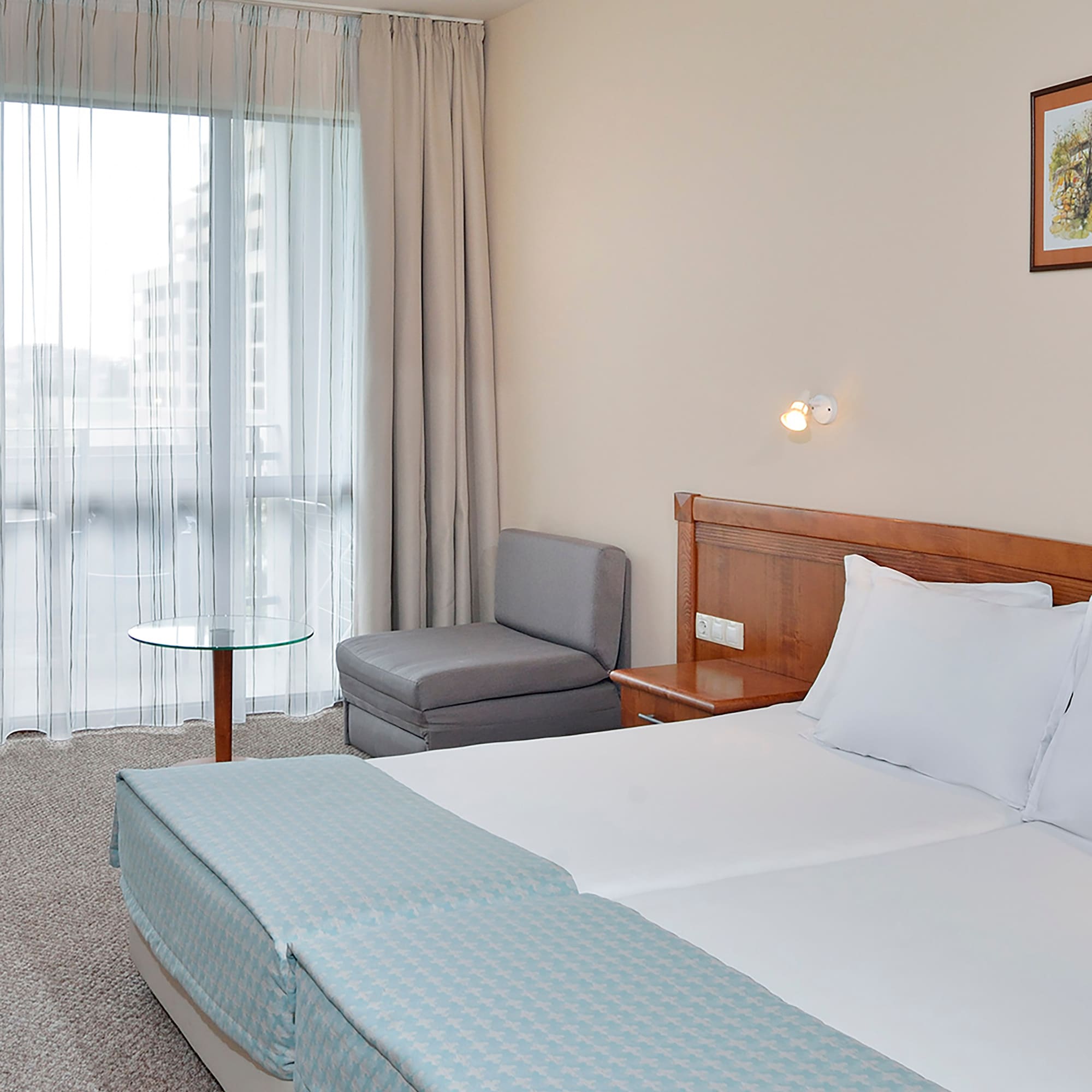 a room with a bed and a chair