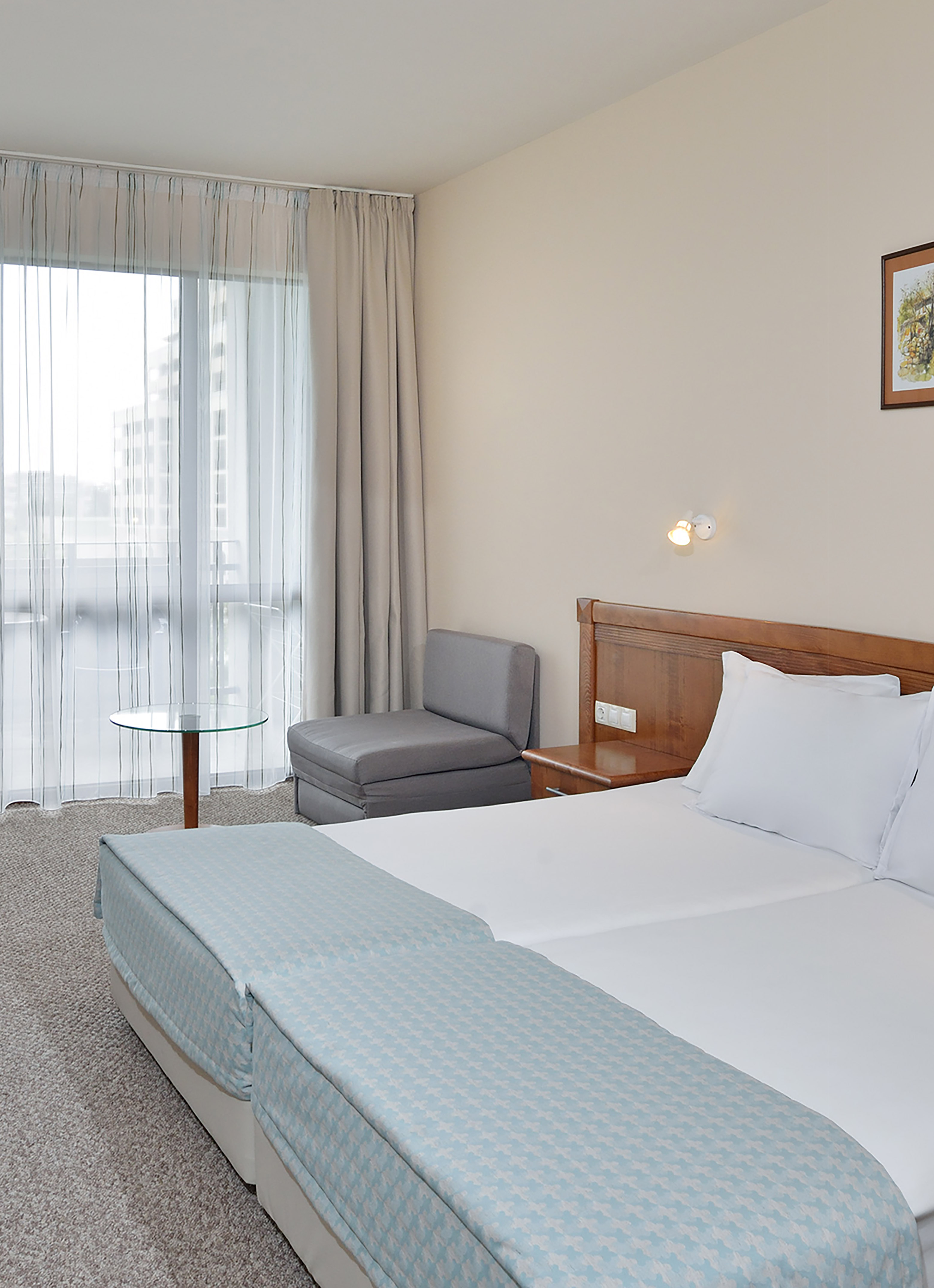 a room with a bed and a chair