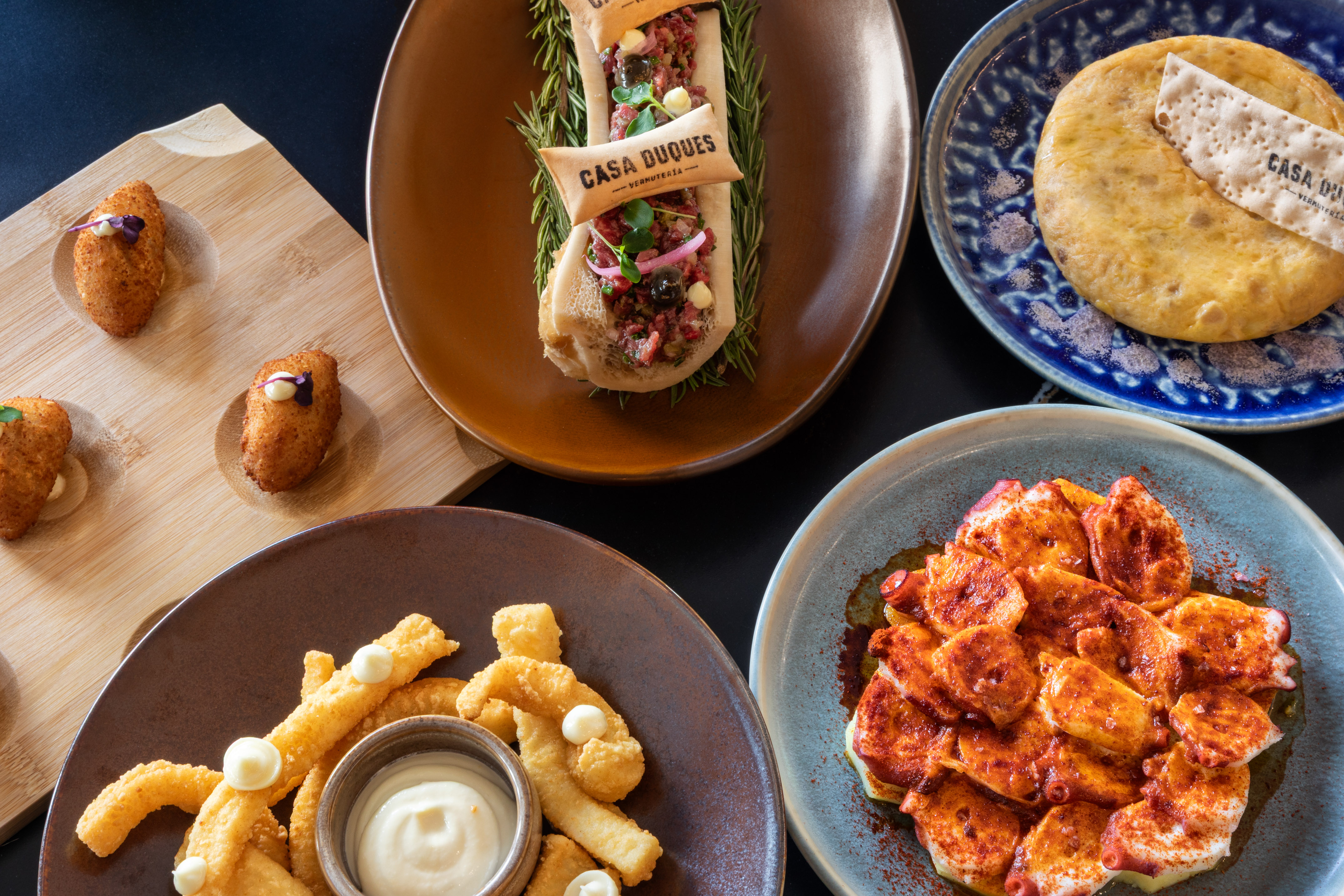 Casa Duques Spanish tapas: croquettes, octopus, bone marrow, tortilla.