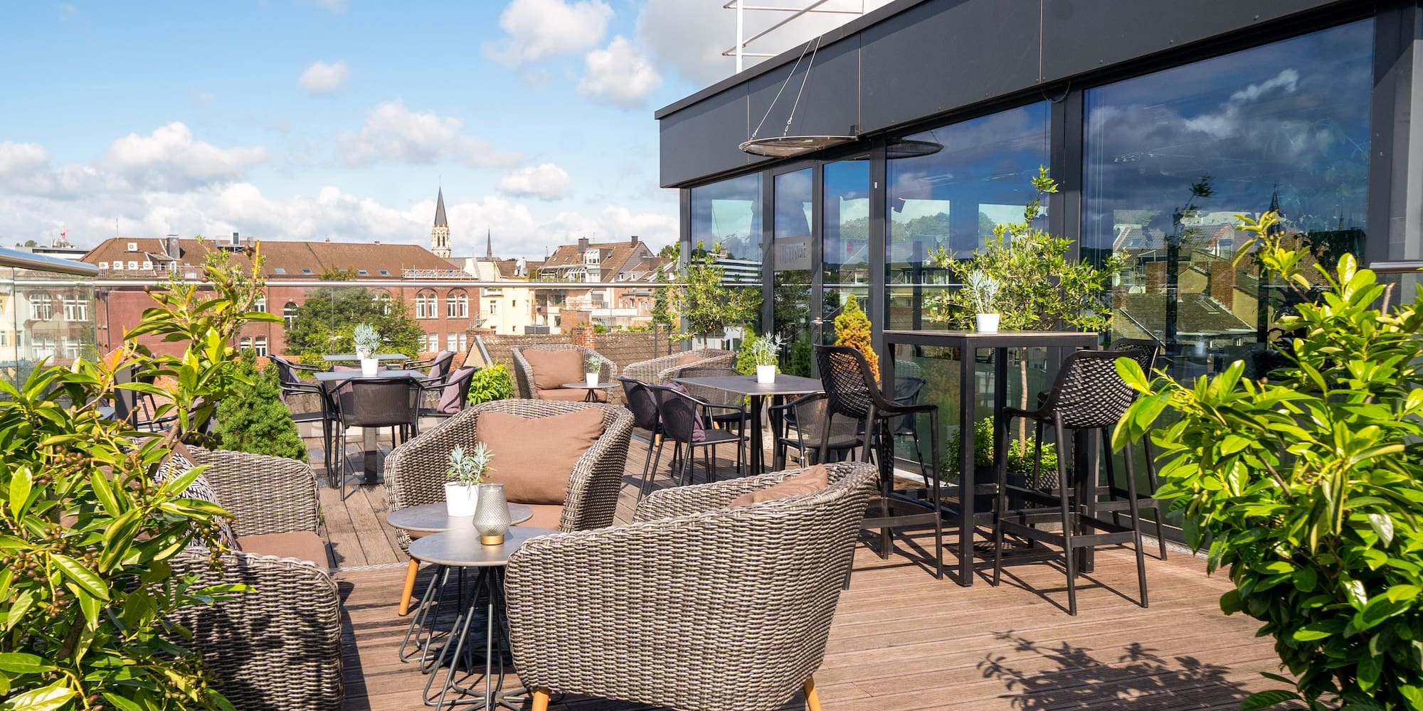 a patio with chairs and tables on a deck