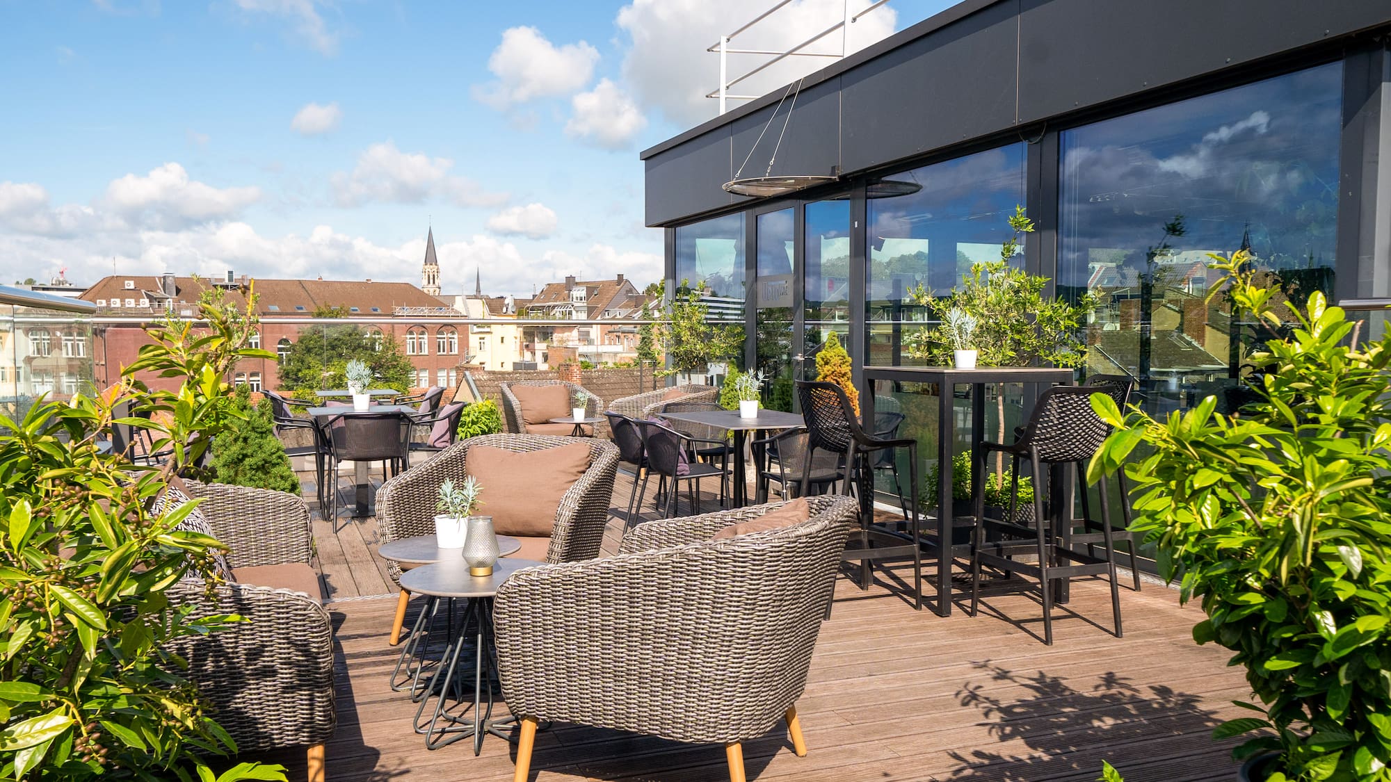 a patio with chairs and tables on a deck