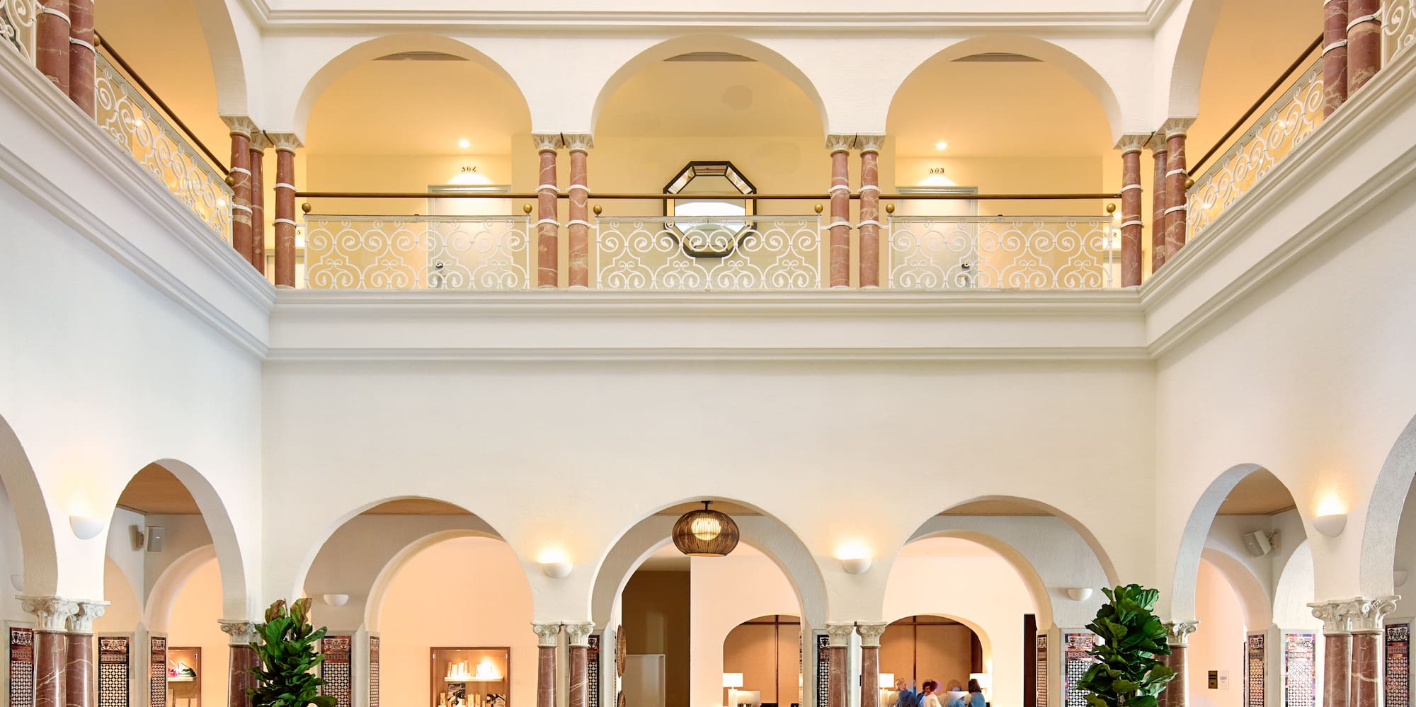 a large room with a large sofa and tables