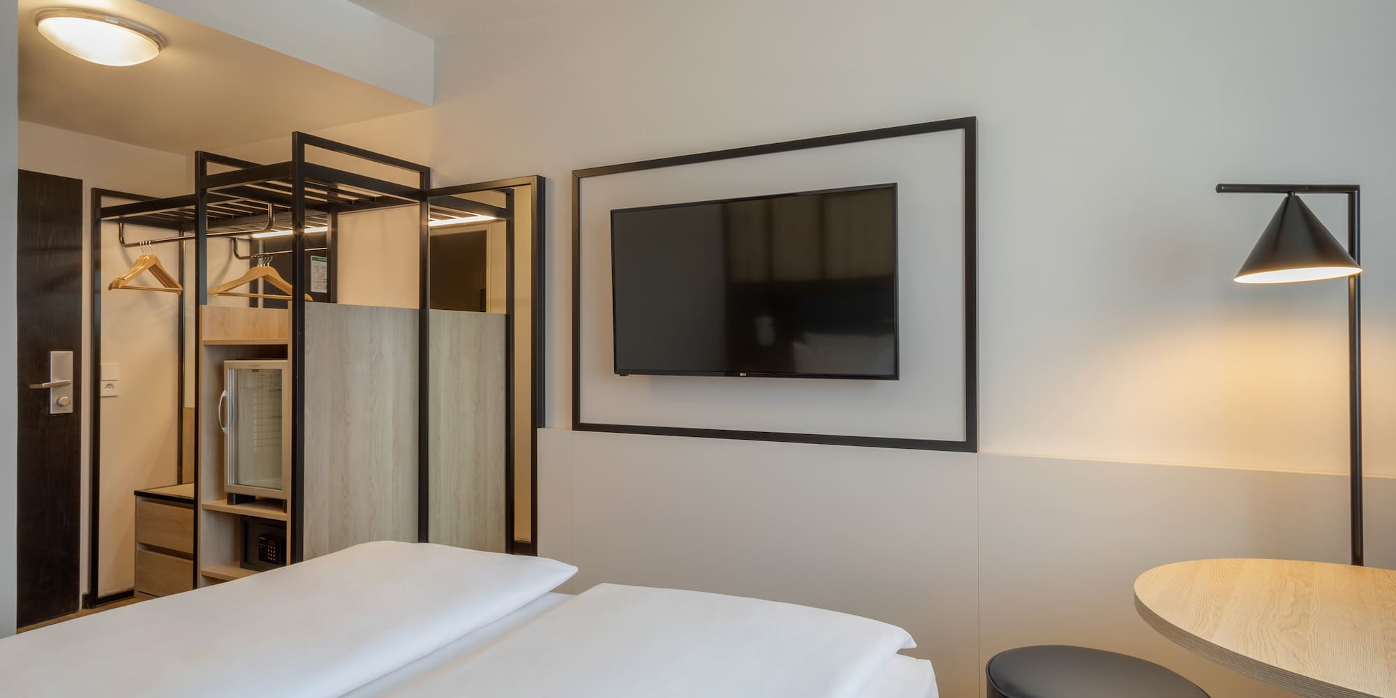 a room with a tv on the wall