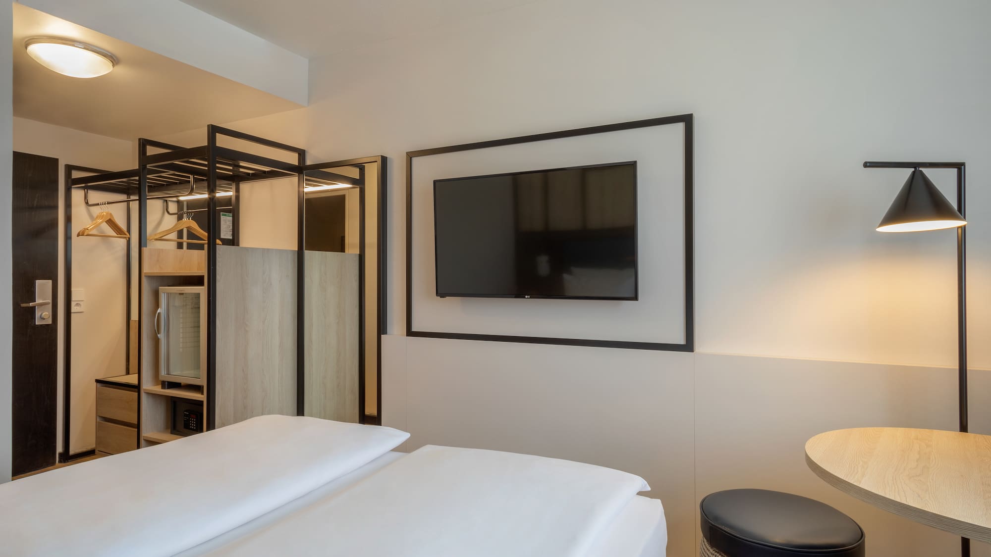 a room with a tv on the wall