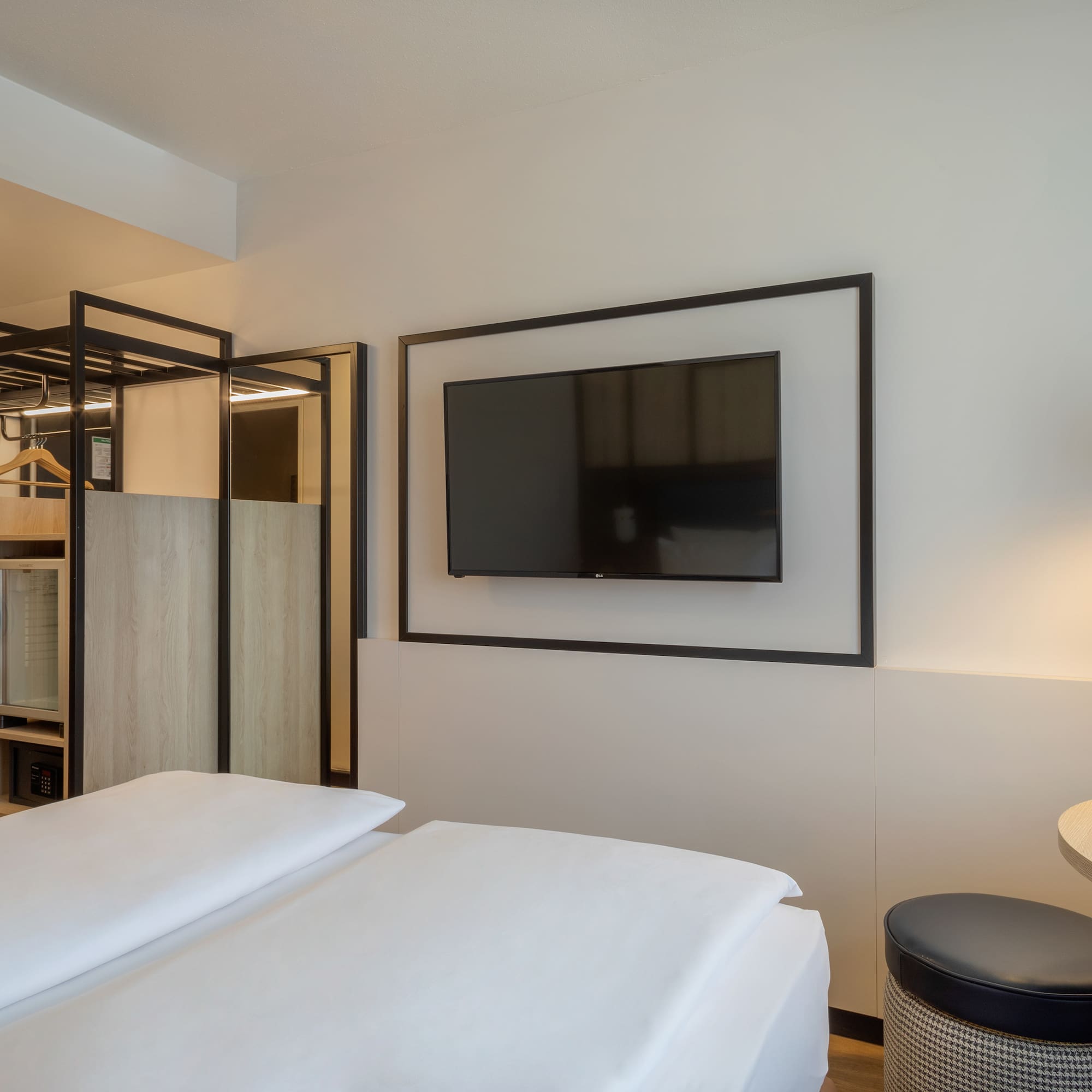 a room with a tv on the wall