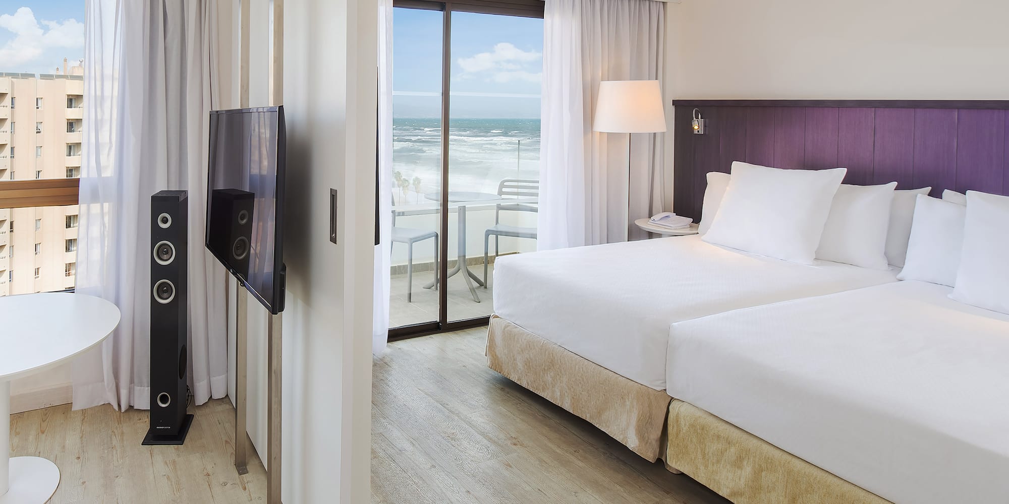 a room with a television and a large bed