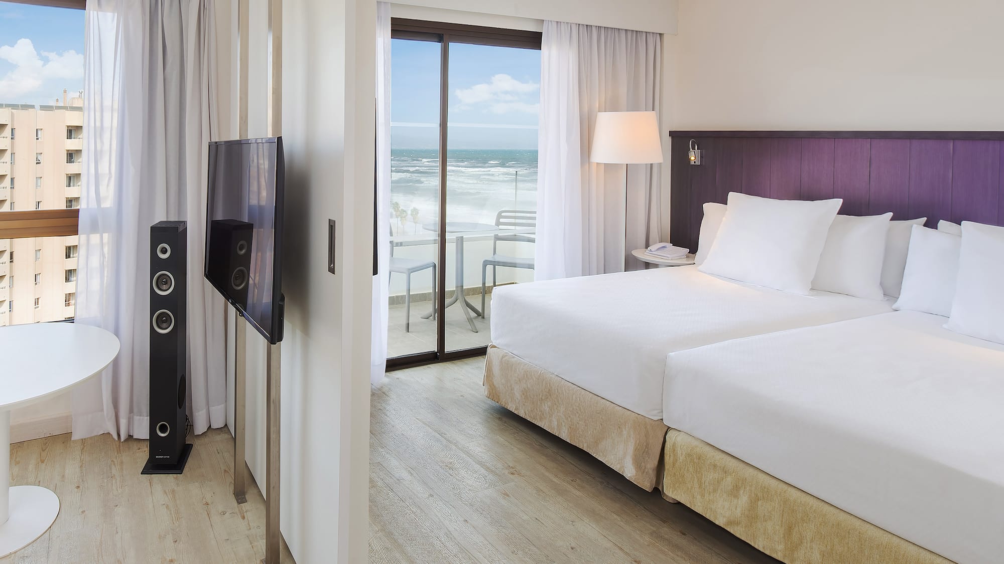 a room with a television and a large bed