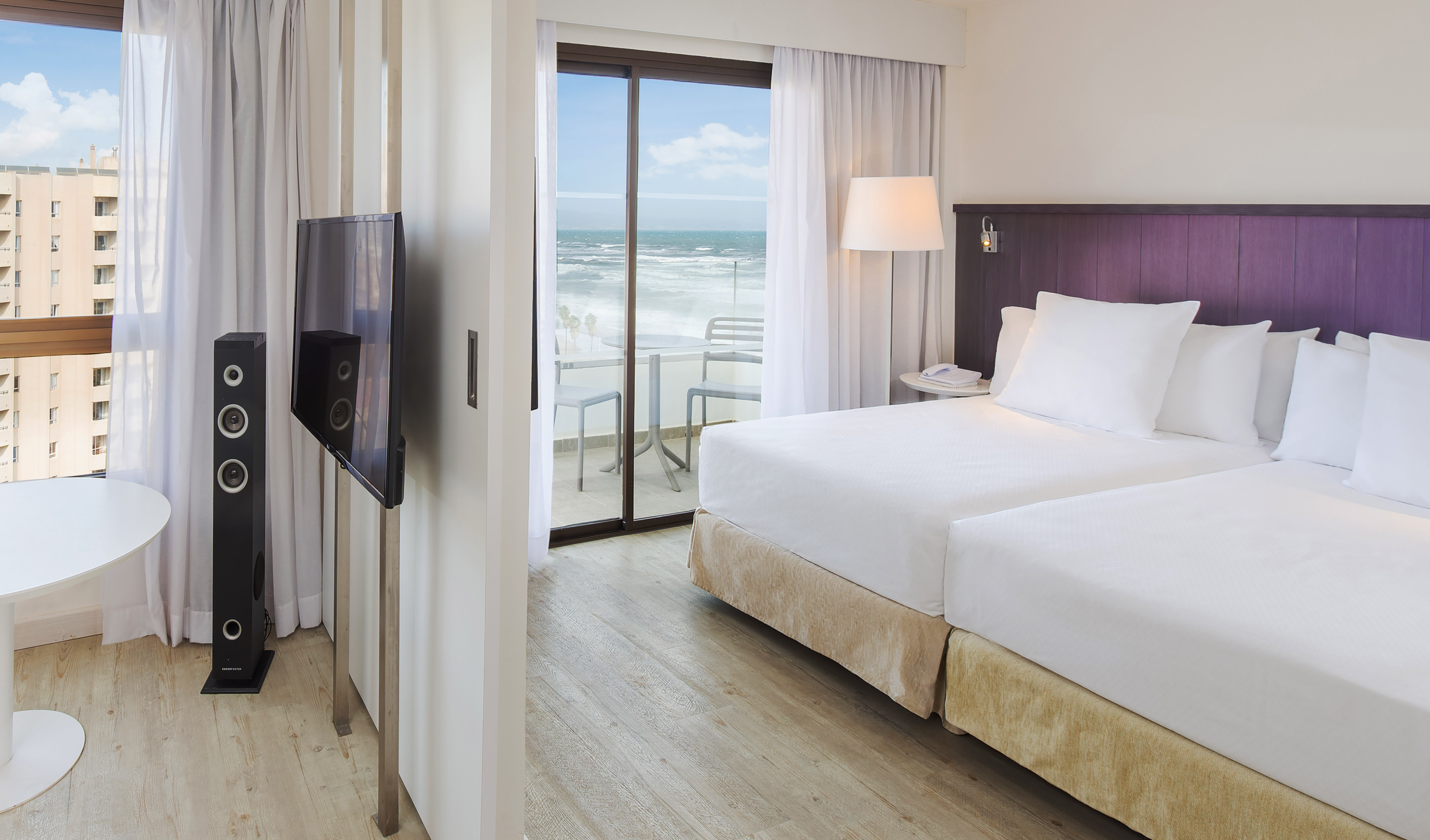 a room with a television and a large bed