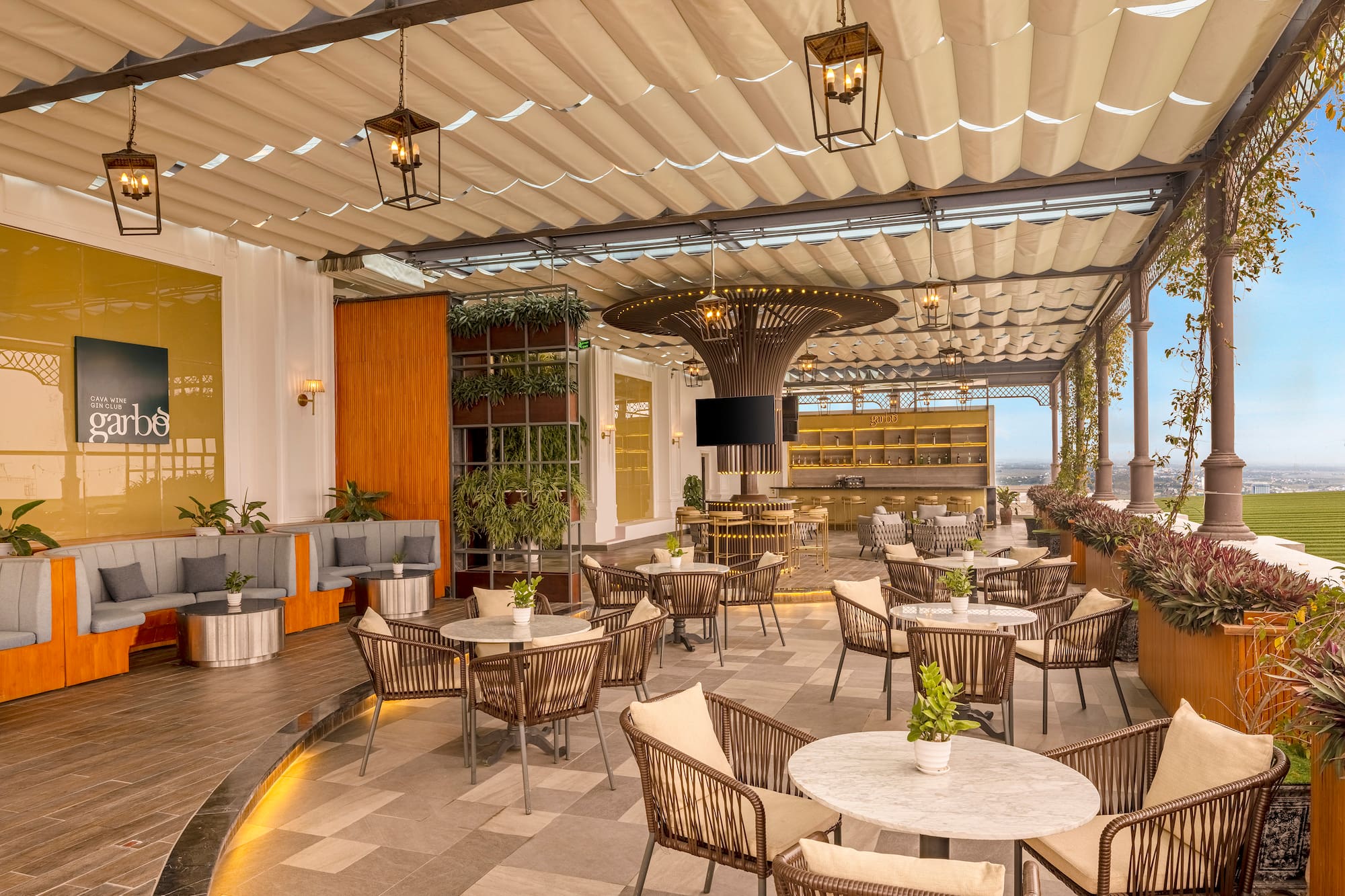 a patio with tables and chairs