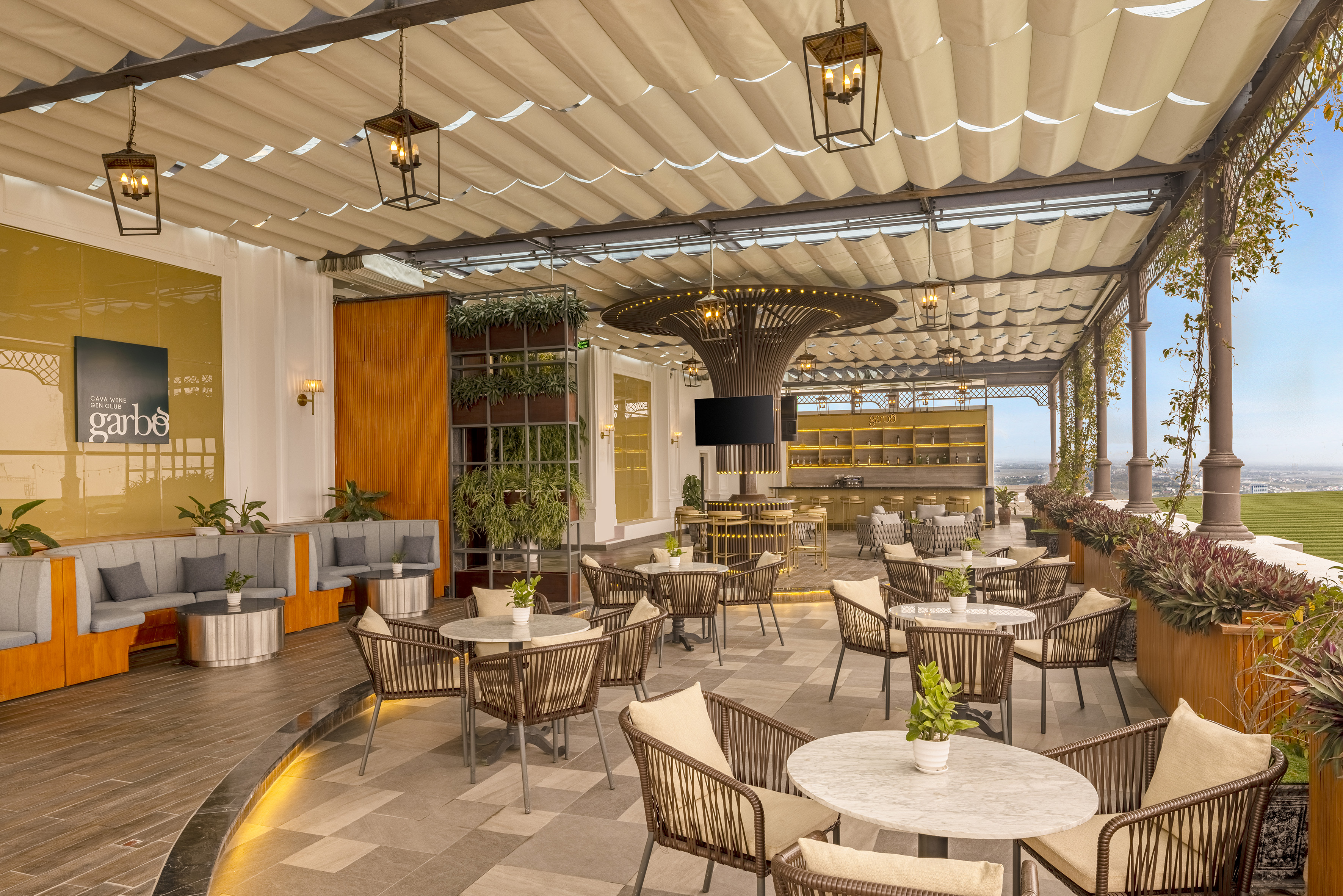 a patio with tables and chairs