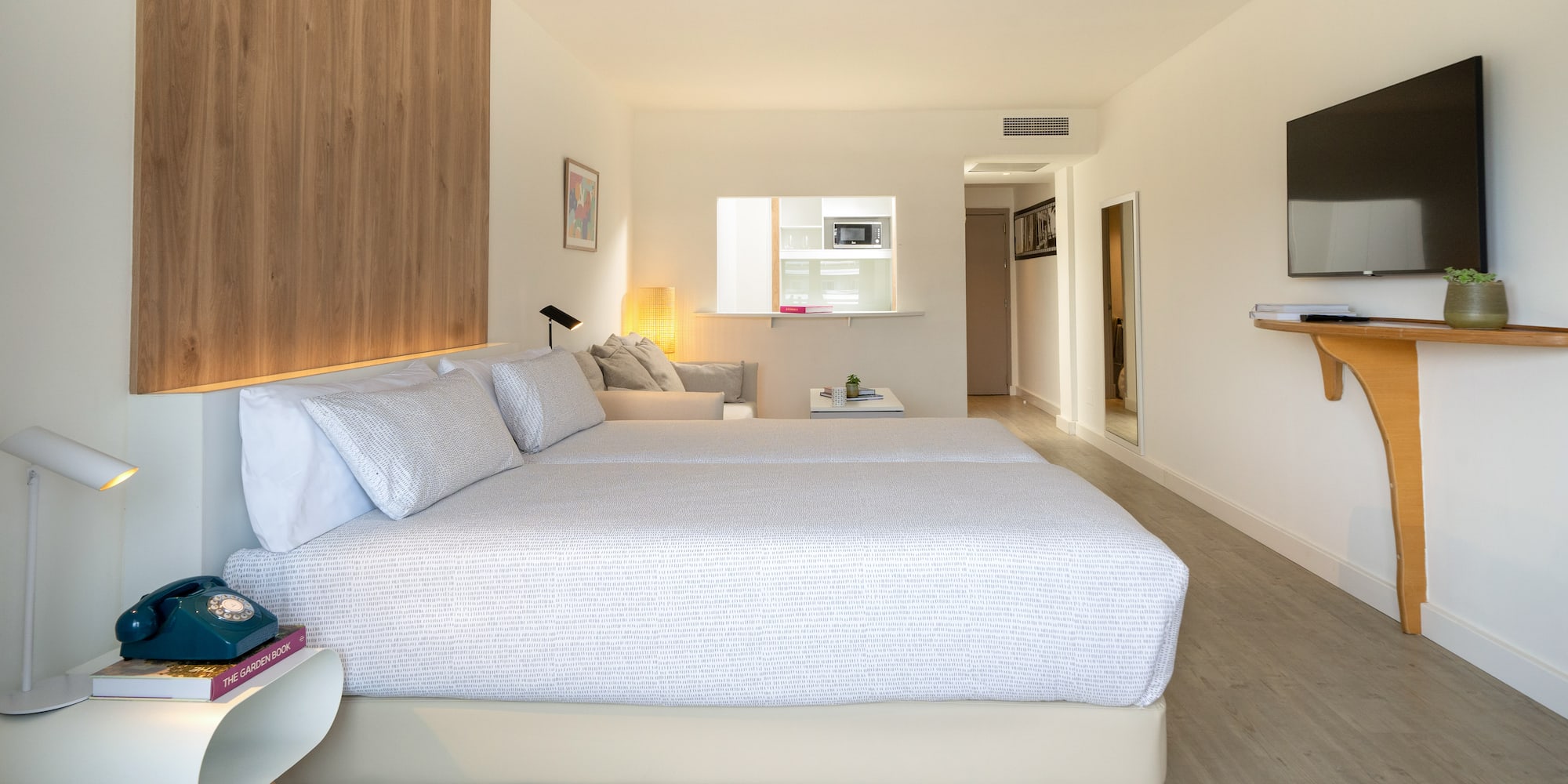 a bedroom with a bed and a tv