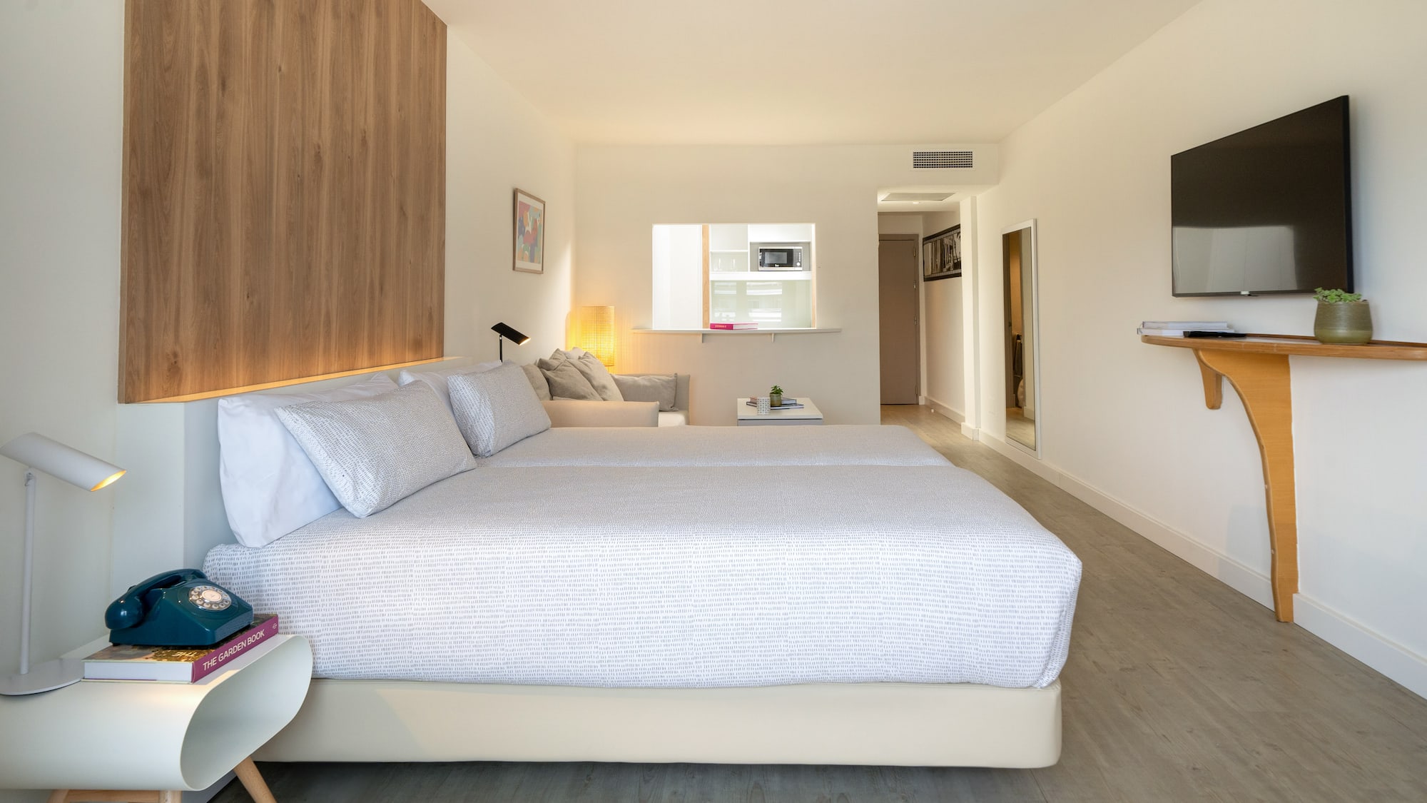 a bedroom with a bed and a tv