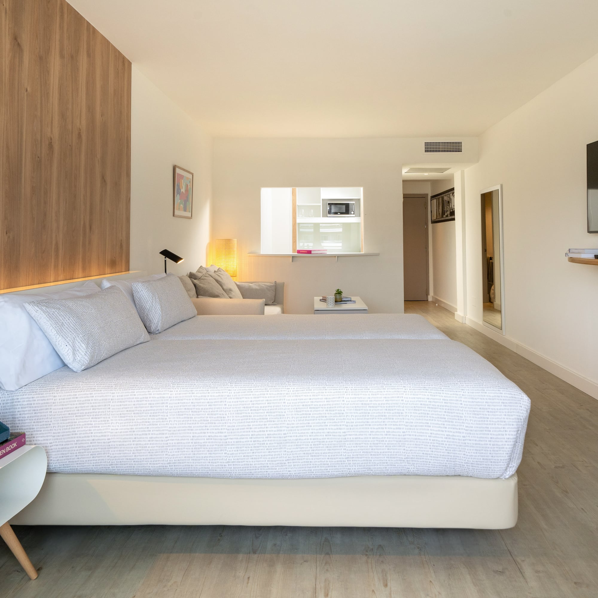 a bedroom with a bed and a tv